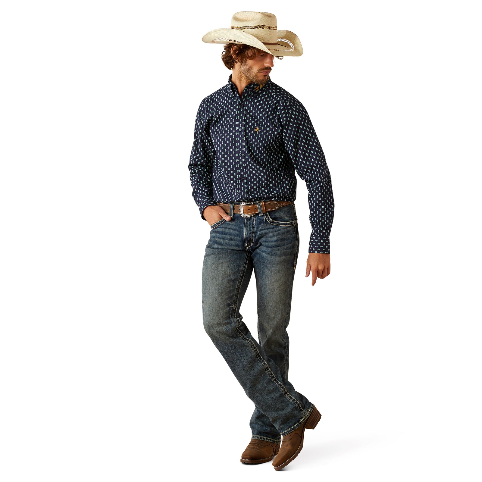 Ariat Men's Team Powell Fitted L/S Western Shirt. Man wearing a patterned shirt, jeans, and a cowboy hat on a white background