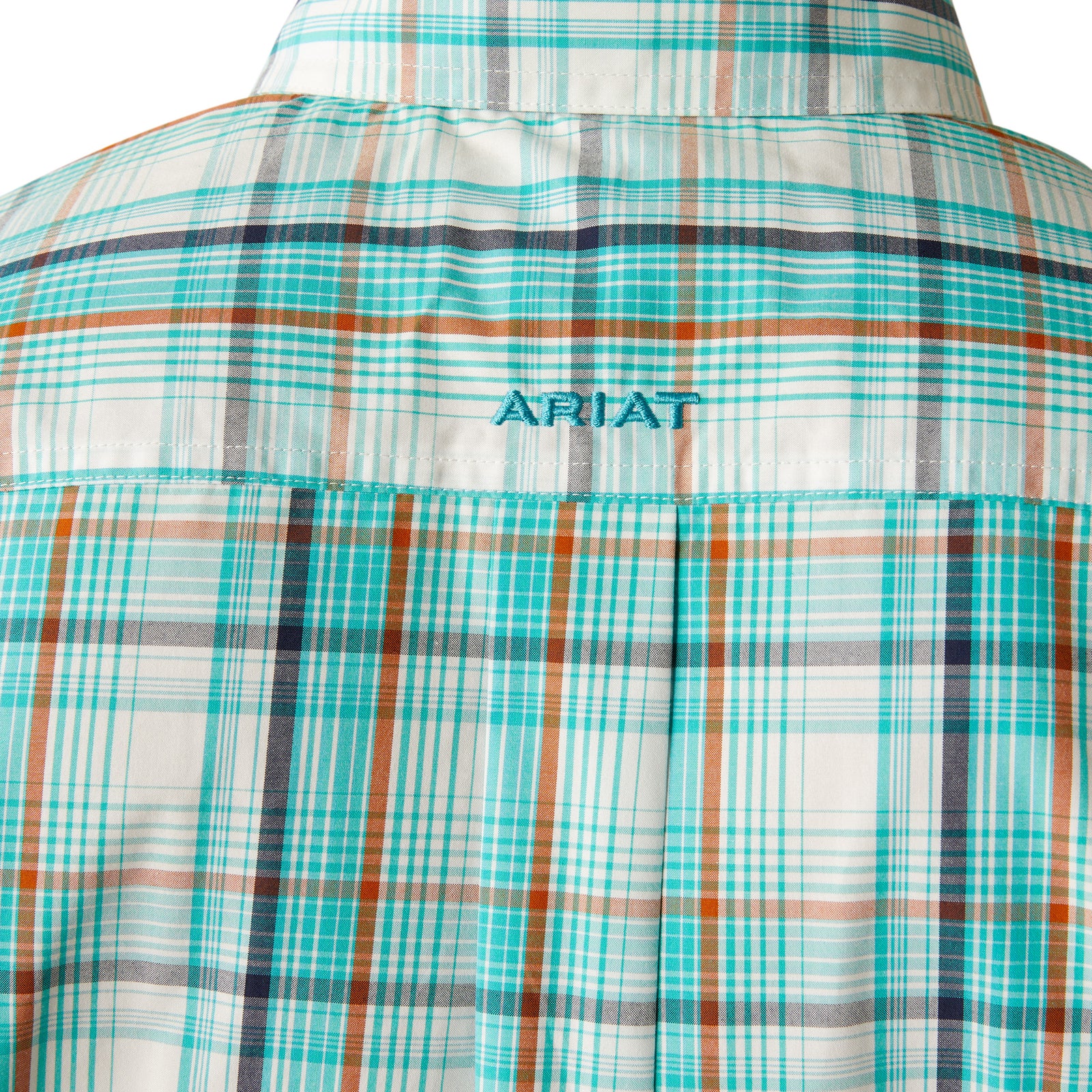 Ariat Men's Pro Series Justice Classic Fit L/S Shirt. Close-up of a plaid shirt with 'Ariat' branding on a white background