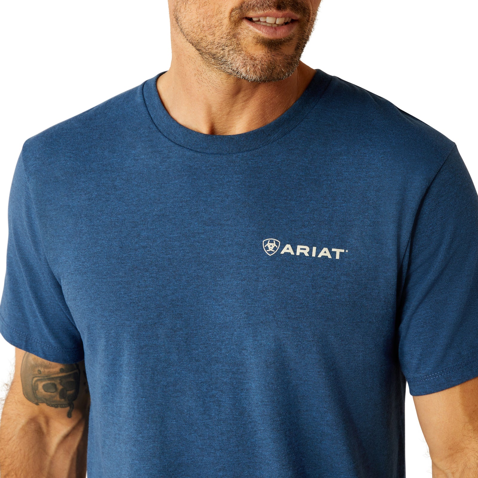 Ariat Men's Line Frame Hex T-Shirt. Man wearing a blue Ariat t-shirt on a white background
