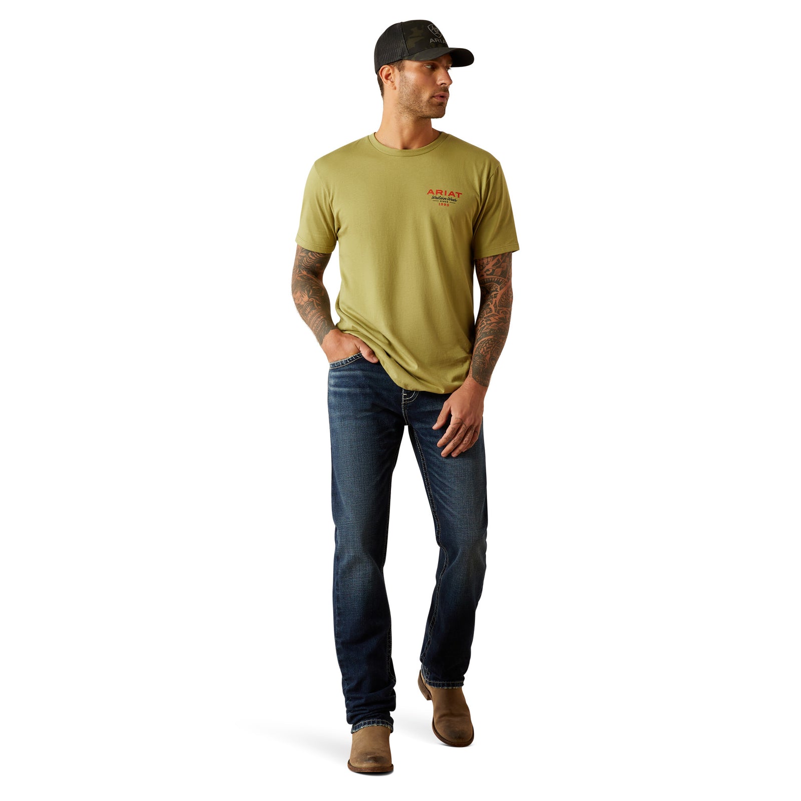 Ariat Men's Full Circle T-Shirt. Man wearing a green t-shirt and jeans walking on a white background