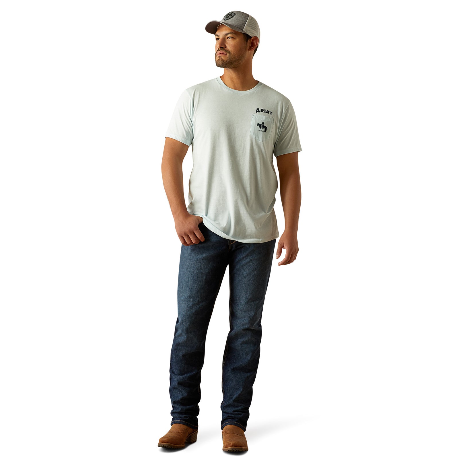 Ariat Men's Echo Valley T-Shirt. Man wearing a light gray t-shirt, dark blue jeans, and a cap on a white background