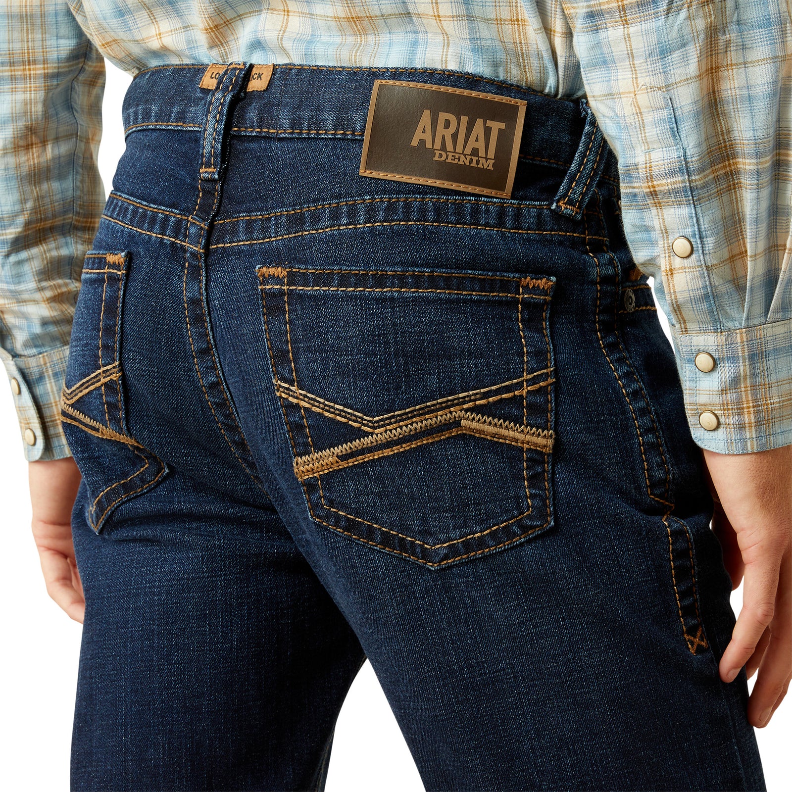 Ariat Men's M8 Modern Shawn Straight Leg Jean. Person wearing blue jeans with an Ariat denim label on a white background