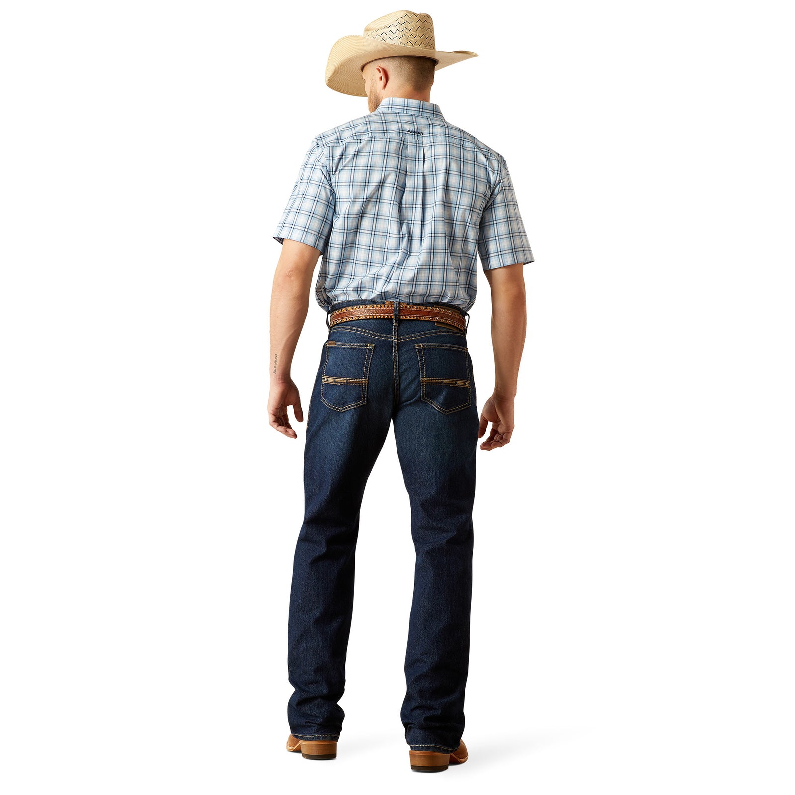 Ariat Men's M4 Otis Boot Cut Jean. Man wearing a plaid shirt, jeans, and a cowboy hat on a white background