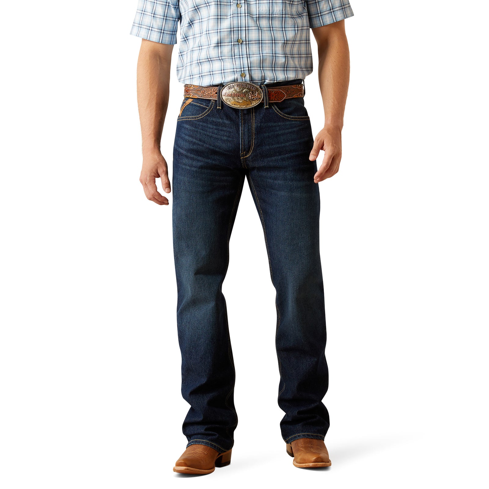 Ariat Men's M4 Otis Boot Cut Jean. Person wearing blue jeans and a plaid shirt on a white background