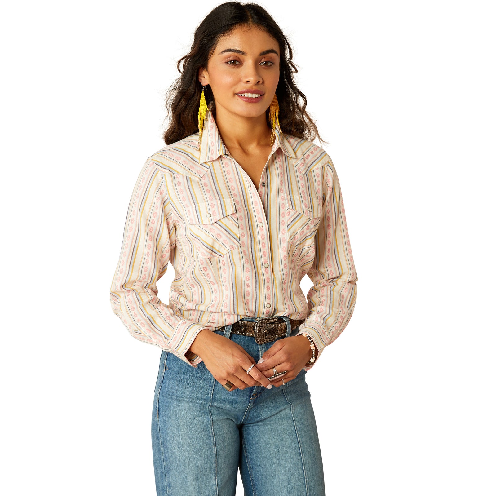 Ariat Women's Alyssa Snap L/S Western Shirt. Woman wearing a patterned shirt and jeans on a white background