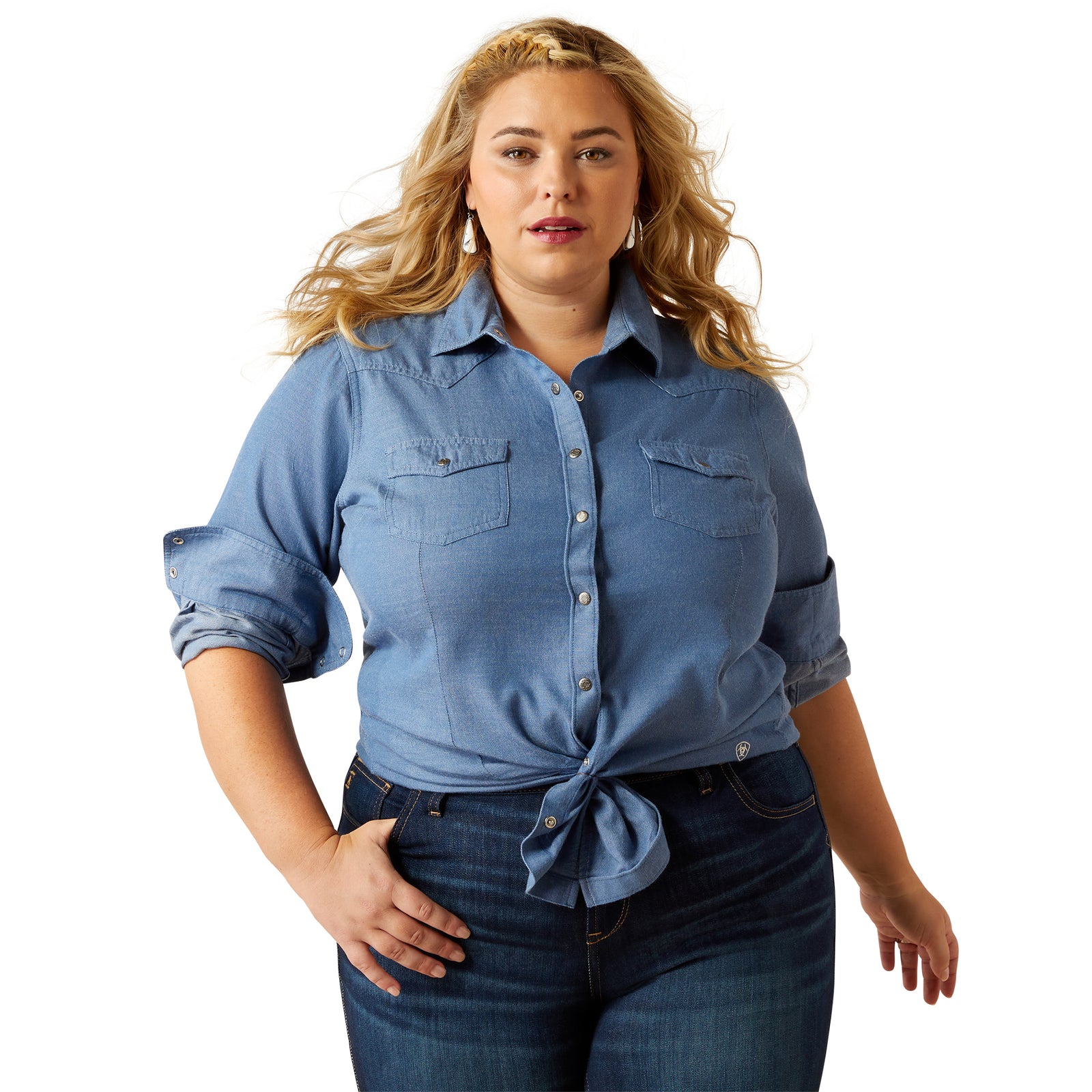 Woman wearing a blue denim shirt and jeans on a white background