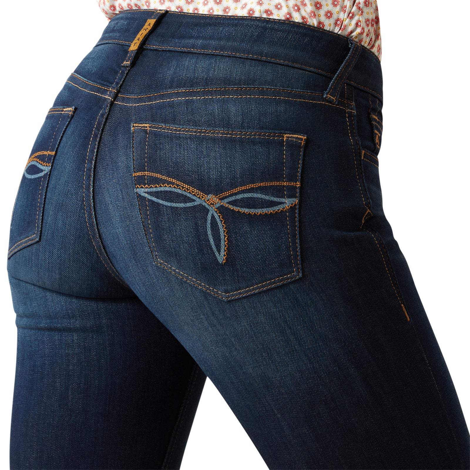 Ariat Women's Juliana Perfect Rise Trouser Jean. Close-up of blue jeans with a white background