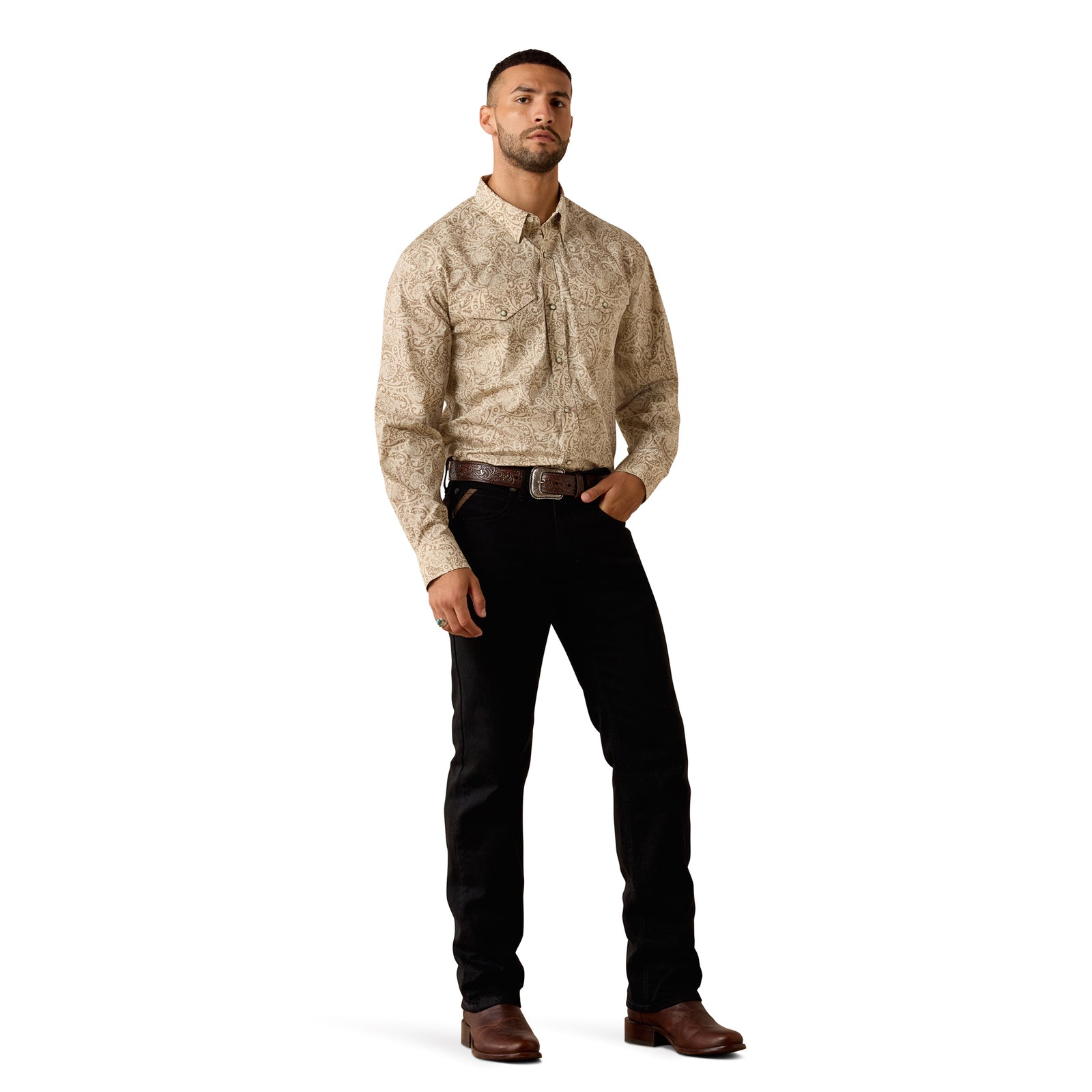 A man modeling a long-sleeve western-style button-up shirt with a beige and brown abstract pattern, paired with black pants and brown boots, against a plain white background.