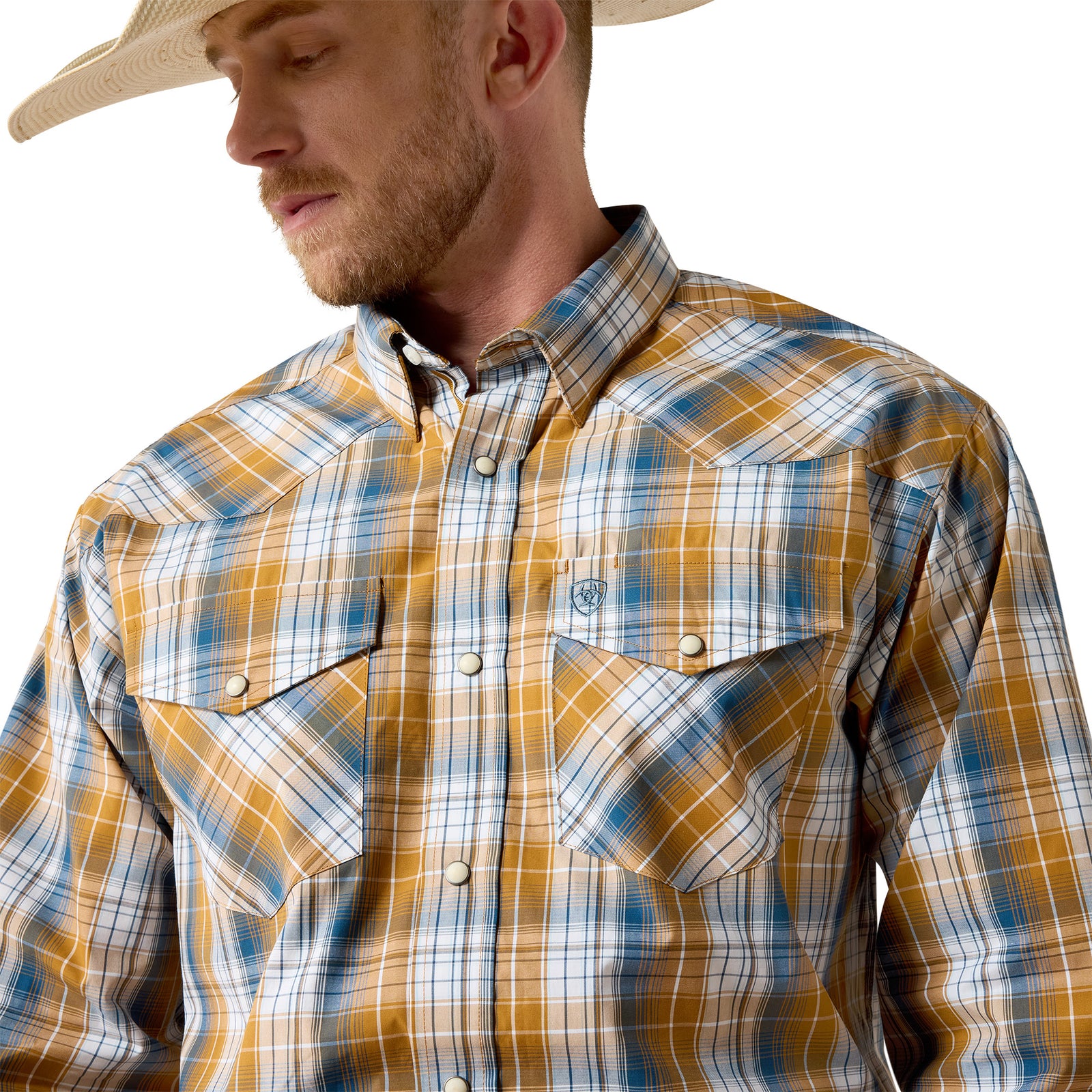 Man wearing a plaid shirt with a neutral background