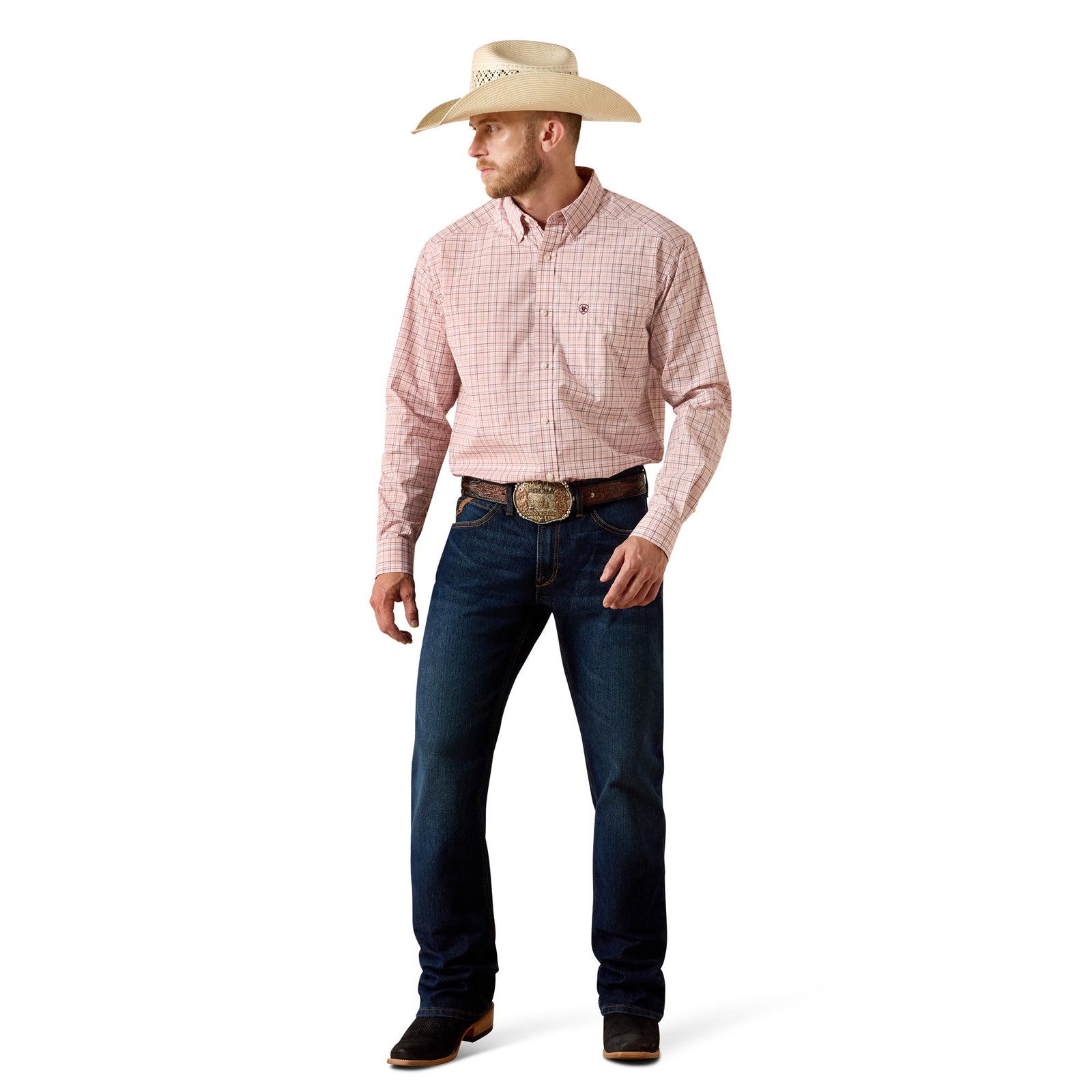A man wearing a light beige cowboy hat, a pink and white checkered western button-down shirt, dark blue jeans, and brown boots, standing against a plain white background.
