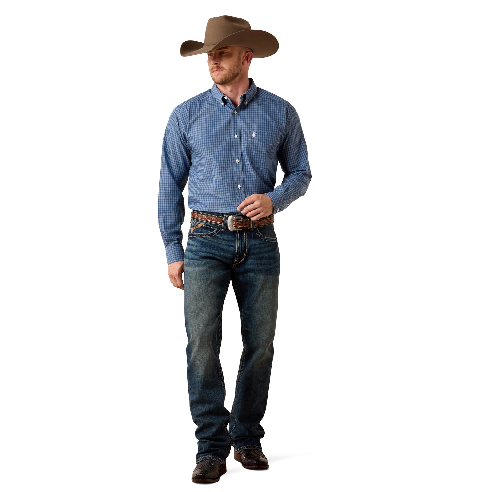 A man modeling a blue and white checkered long-sleeve western shirt, dark blue jeans, a brown cowboy hat, and a brown leather belt with a silver buckle, standing against a solid white background.