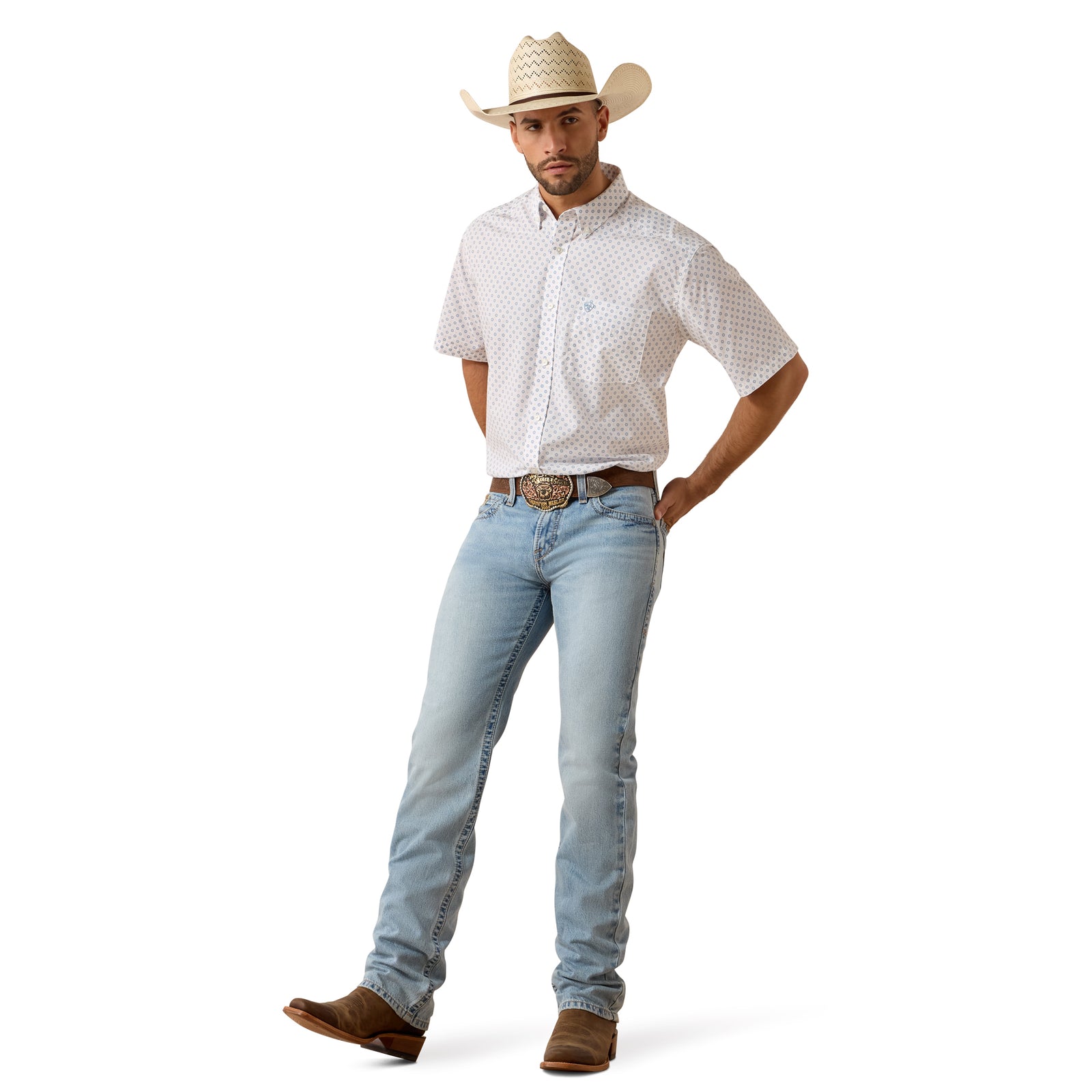 Man wearing a white patterned shirt, light blue jeans, and a straw cowboy hat on a white background