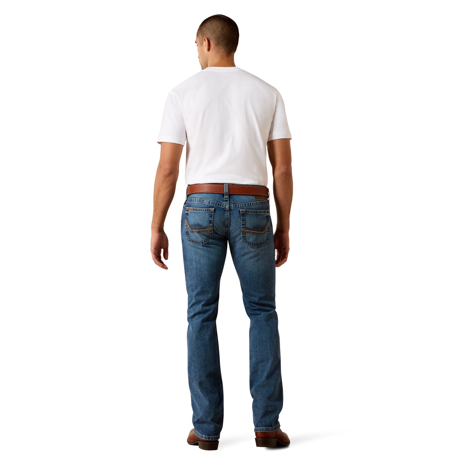 Man wearing blue jeans and a white t-shirt on a white background