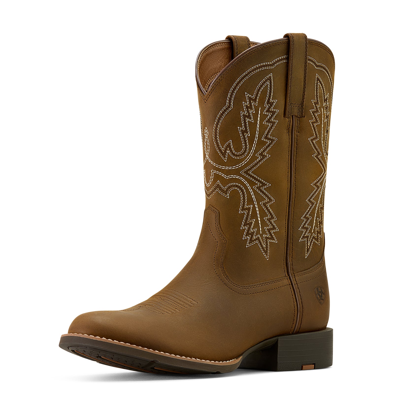 Brown cowboy boot with intricate white stitching on a white background