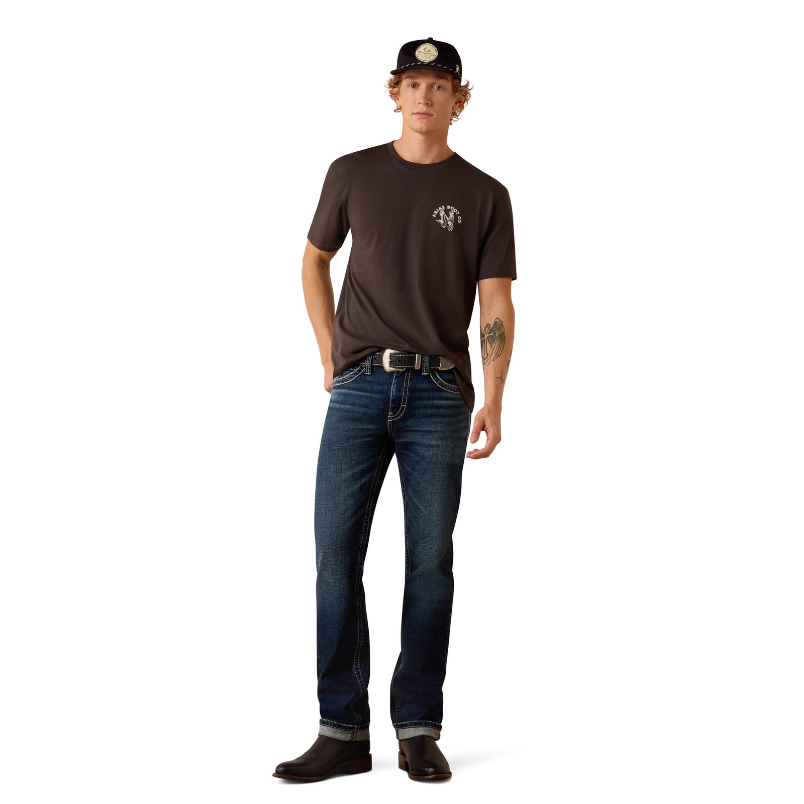 Man wearing a brown t-shirt and blue jeans on a white background