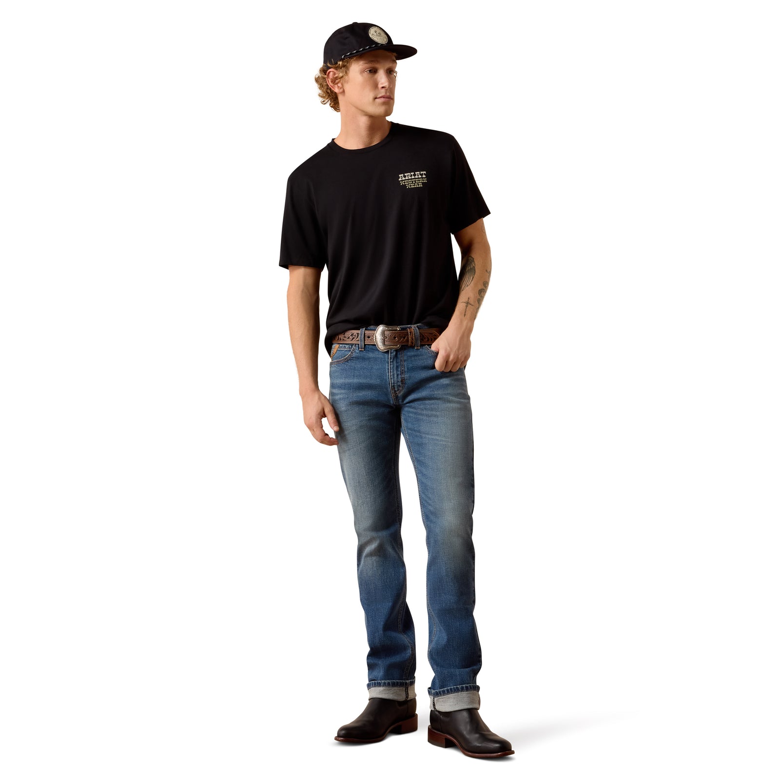 Man wearing a black t-shirt, blue jeans, and a cap on a white background