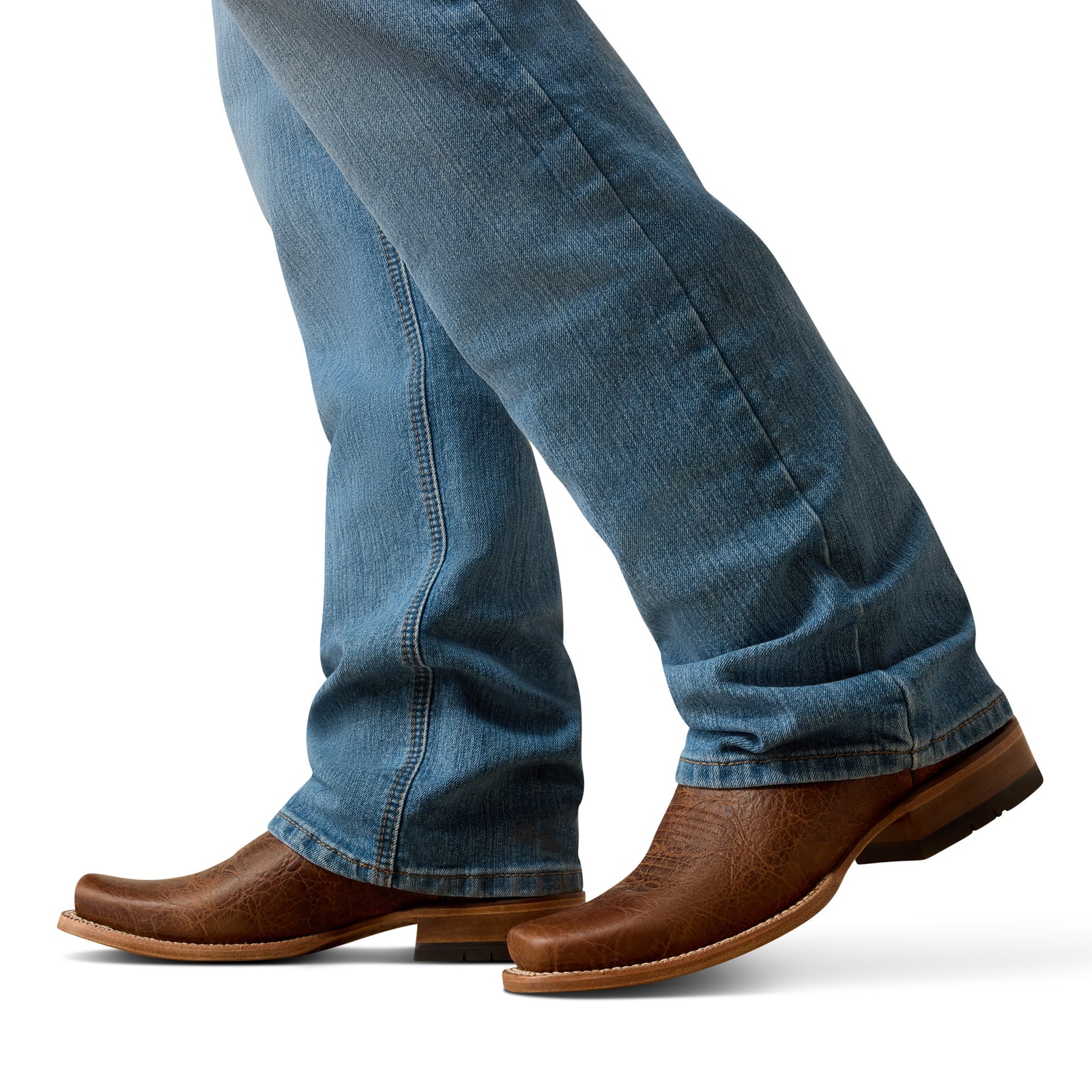 Brown leather boots and blue jeans on a white background