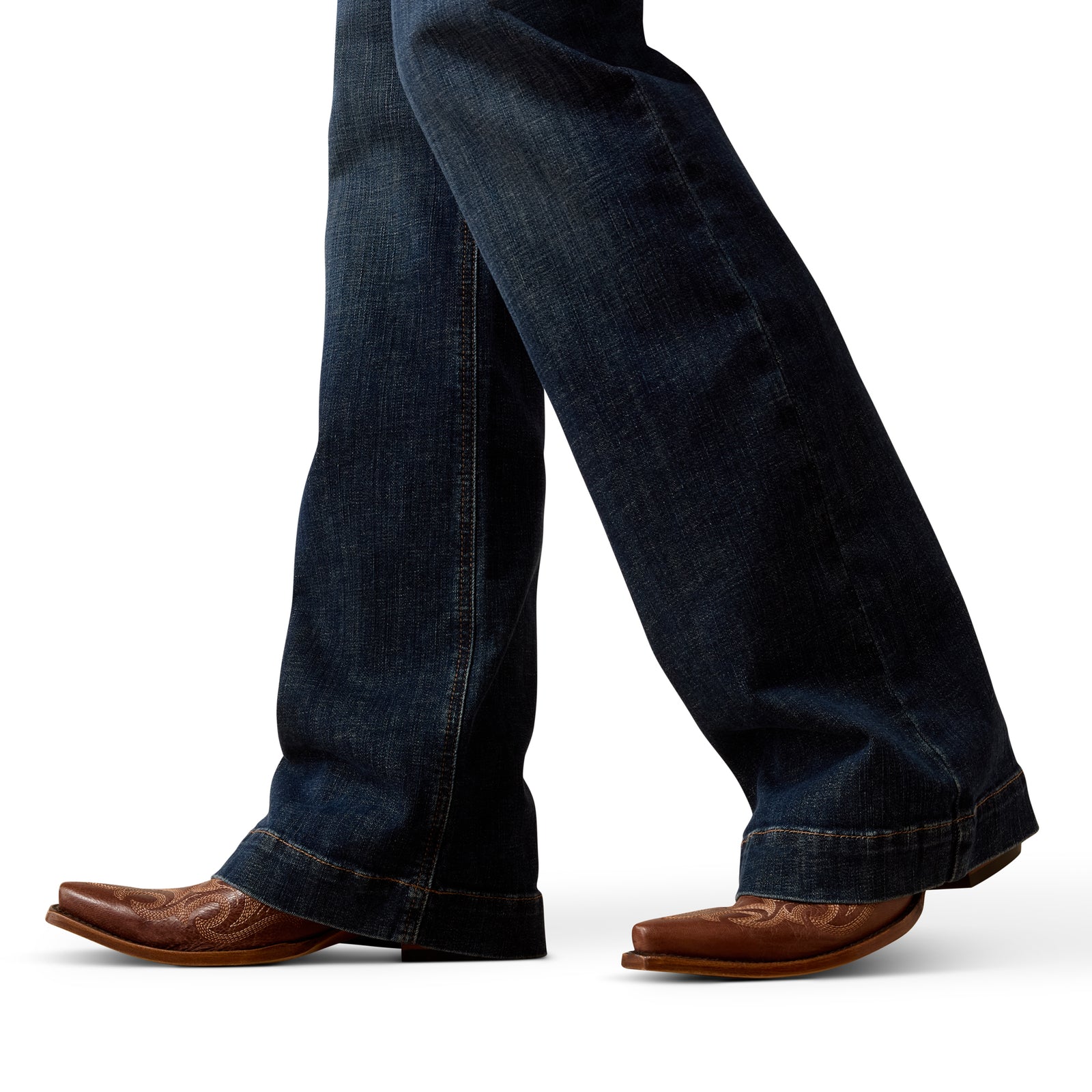 Blue jeans and brown boots on a white background