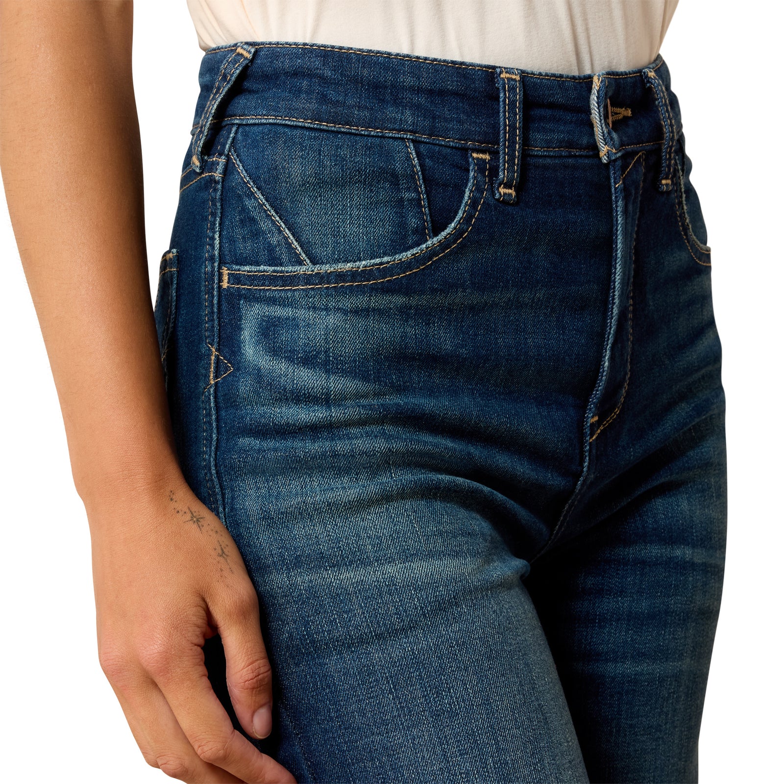 Close-up of blue jeans with a white background