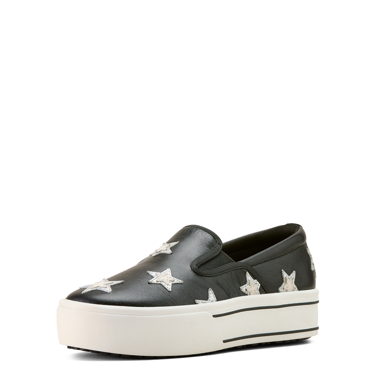 Black slip-on sneaker with white star designs on a white background