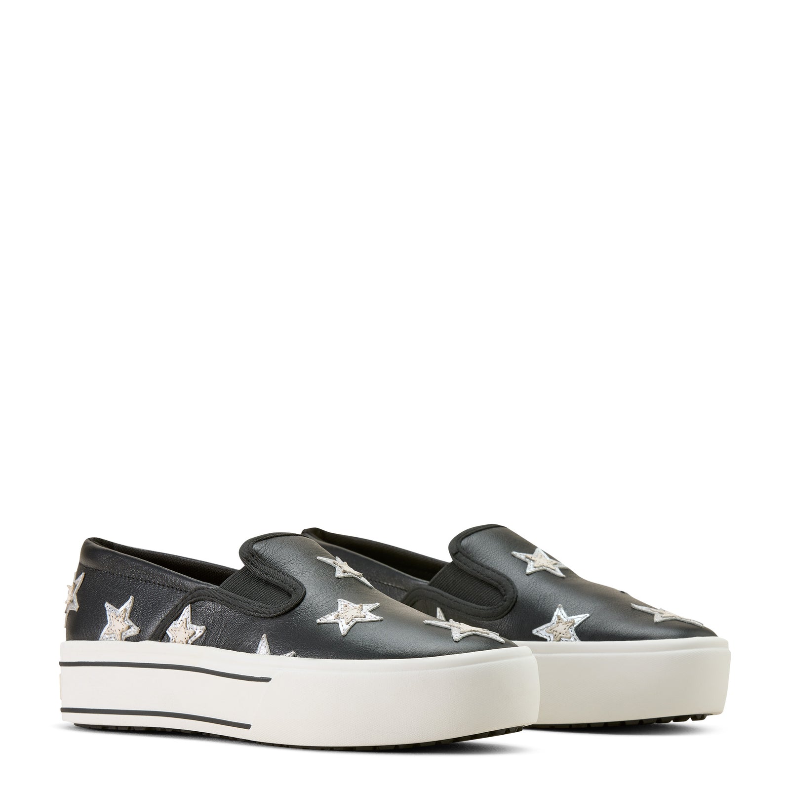 Black slip-on shoes with white star patterns on a white background