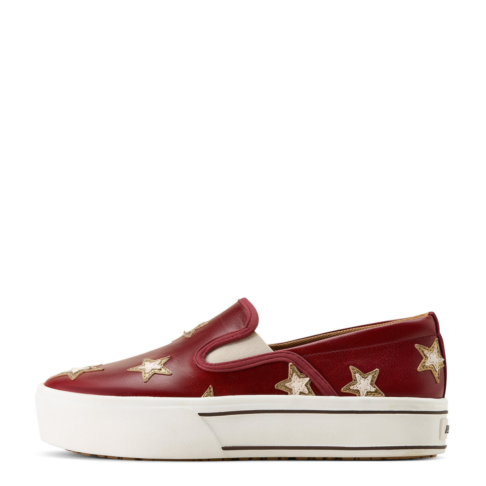 Red slip-on sneaker with gold stars on a beige background