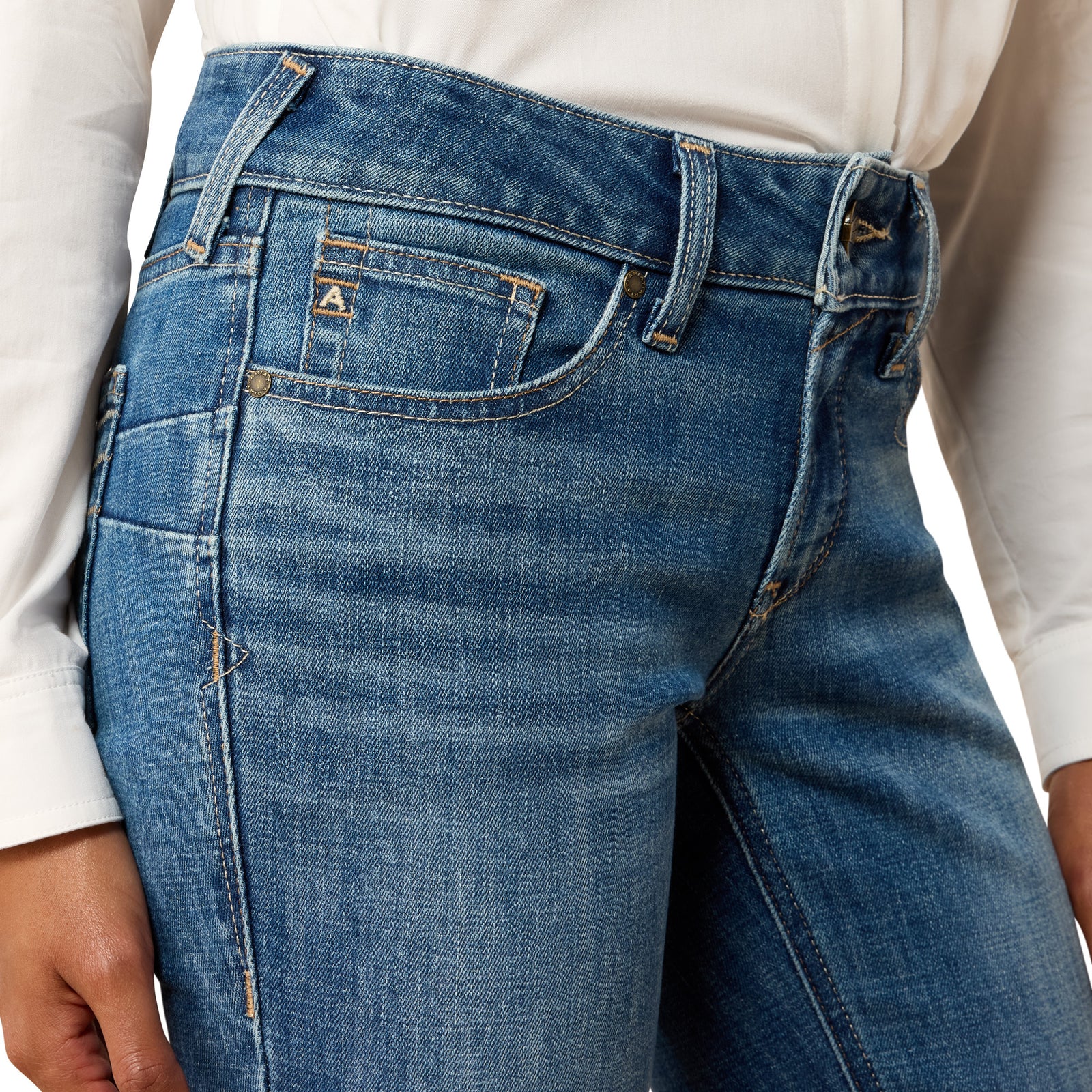 Close-up of blue jeans with a neutral background