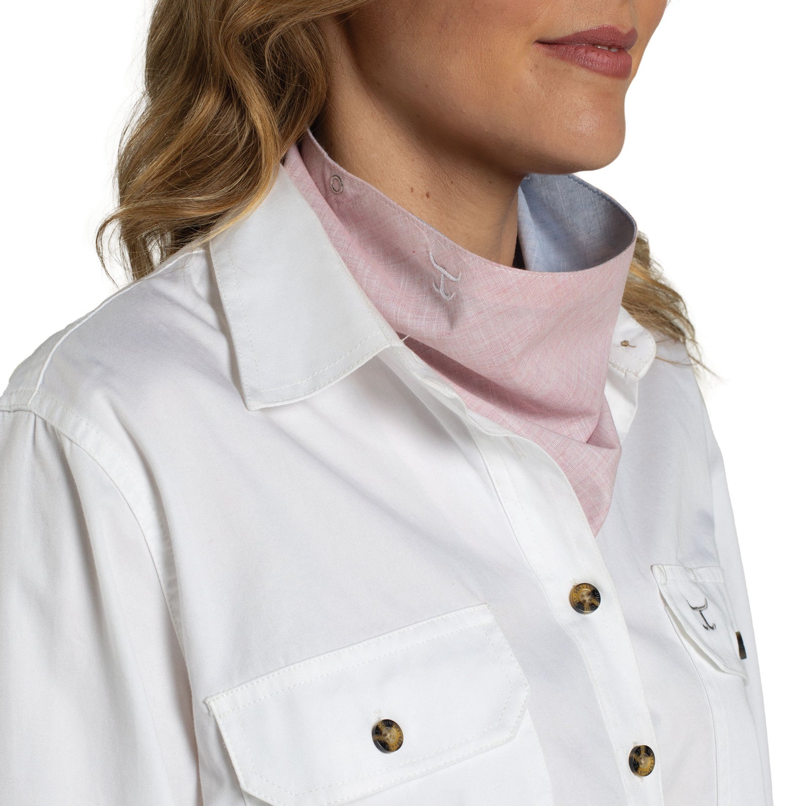 Close-up of a person wearing a white jacket with a pink shirt underneath on a white background