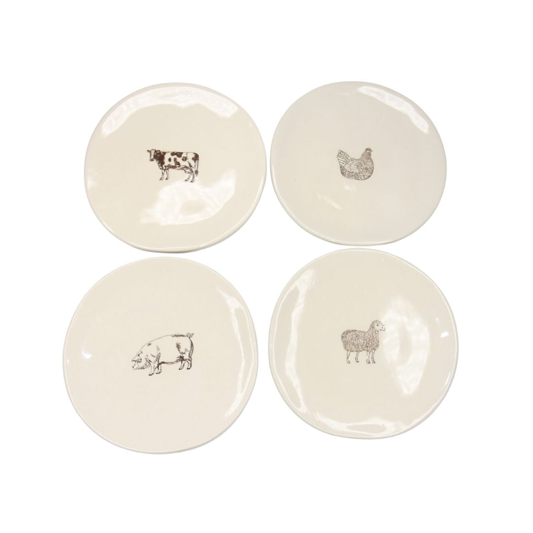 Farm Design Set of 4 Small Ceramic Plates. Four white ceramic plates with animal illustrations on a white background