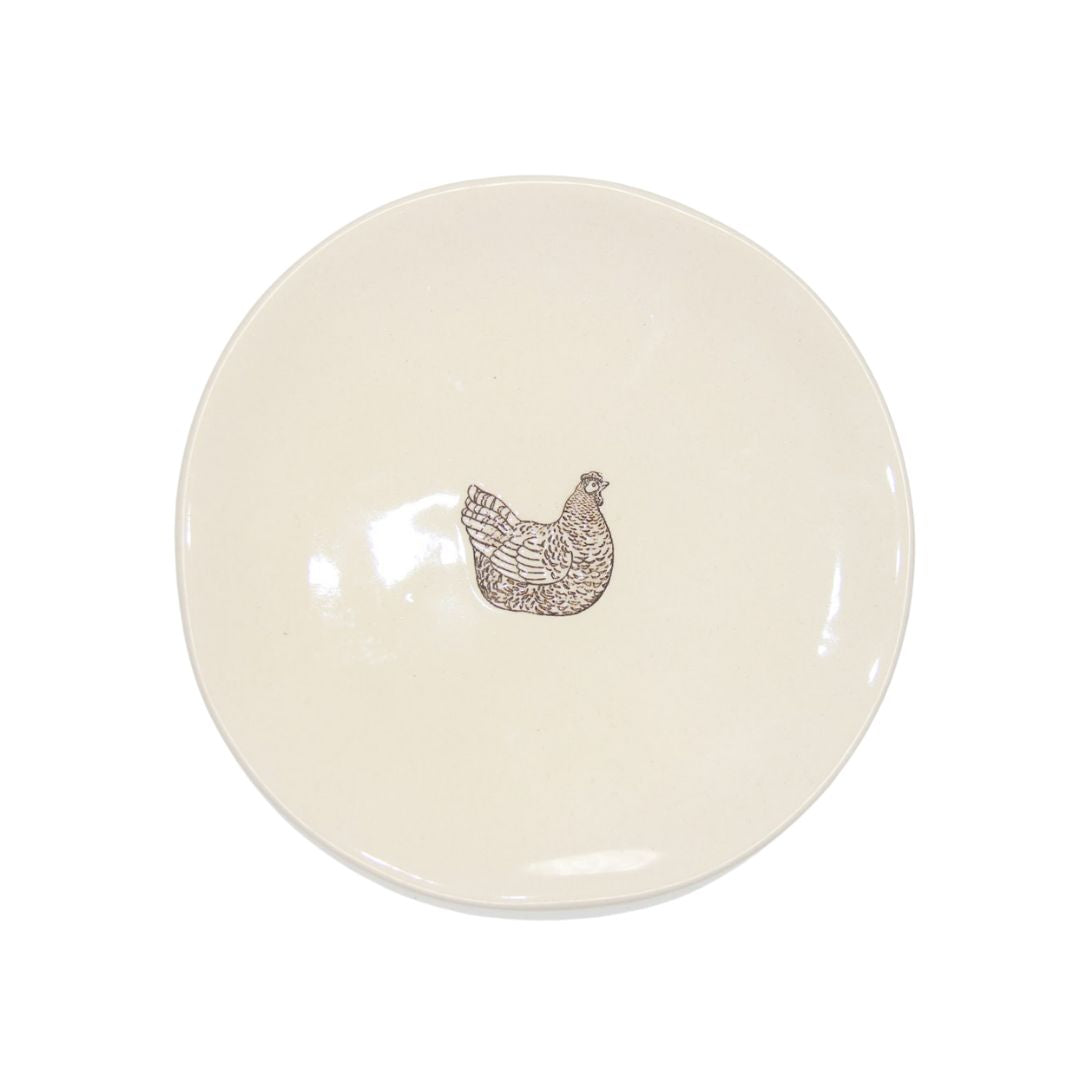 Farm Design Set of 4 Small Ceramic Plates. Round ceramic plate with a chicken design on a white background