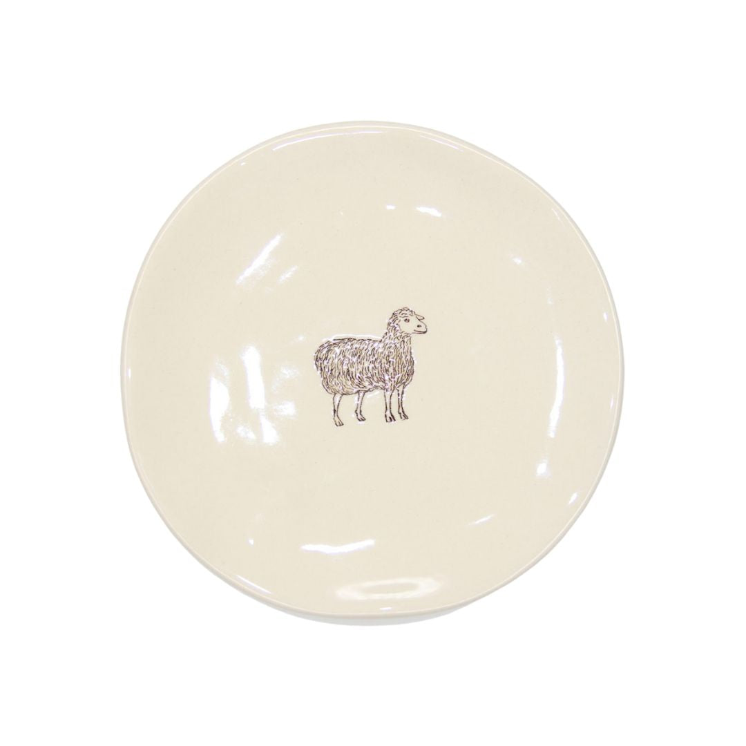 Farm Design Set of 4 Small Ceramic Plates. Round ceramic plate with a sheep design on a white background