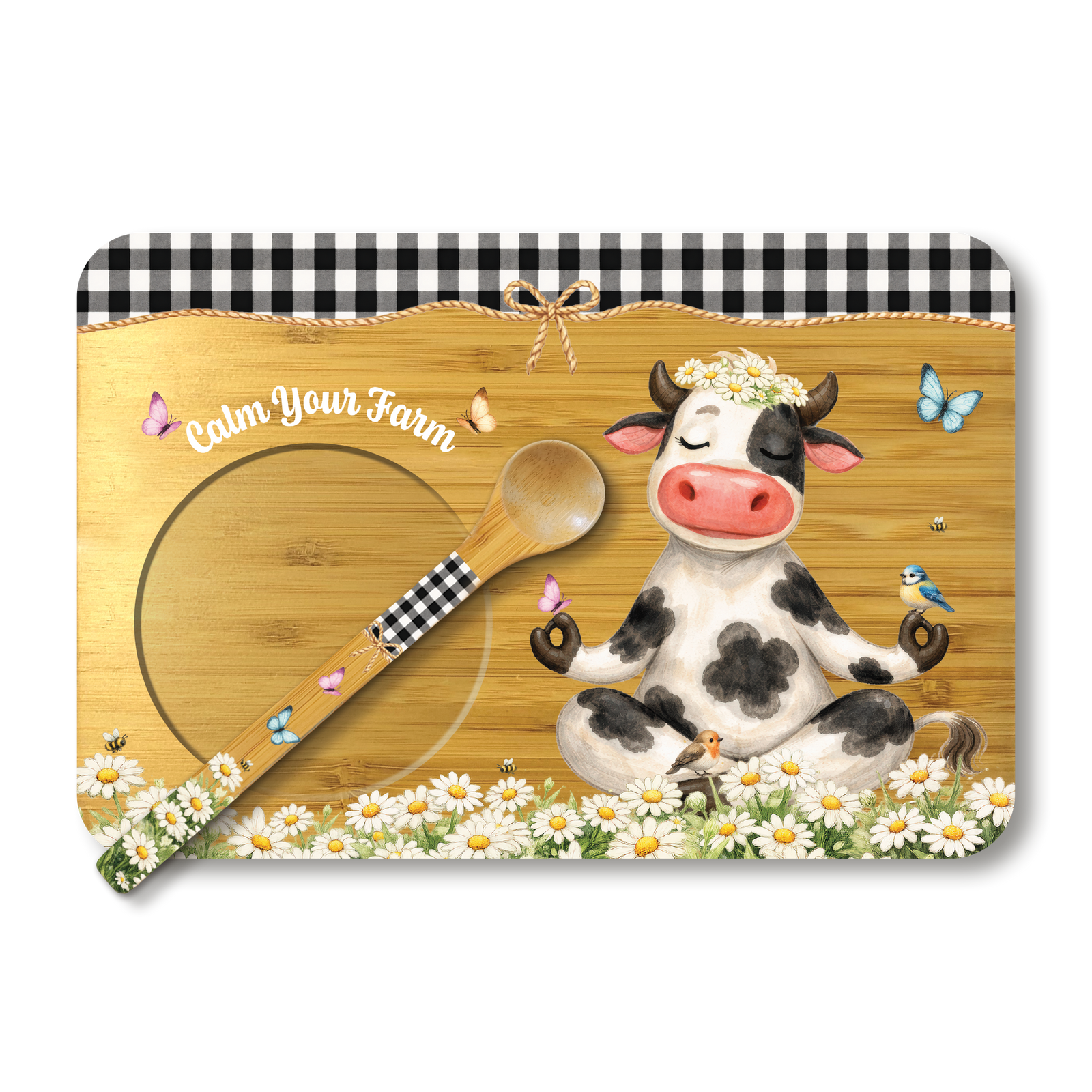 A rectangular decorative placemat or board with a rustic farm-themed illustration. The design includes a black-and-white gingham border at the top, a wood-grain center, a meditating cow with a flower crown, daisies along the bottom, a wooden spoon with a gingham handle, and small butterflies.
