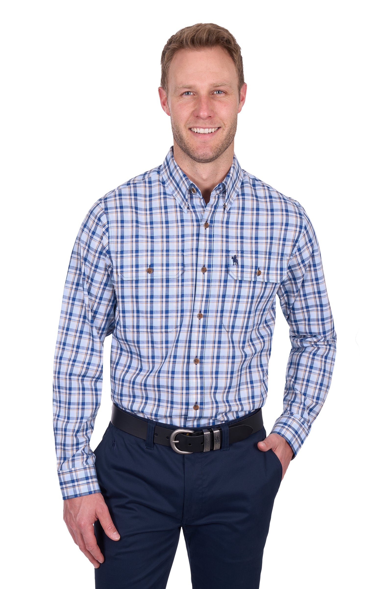Thomas Cook Men's Thomas L/S Shirt. Man wearing a blue plaid shirt and navy pants on a white background