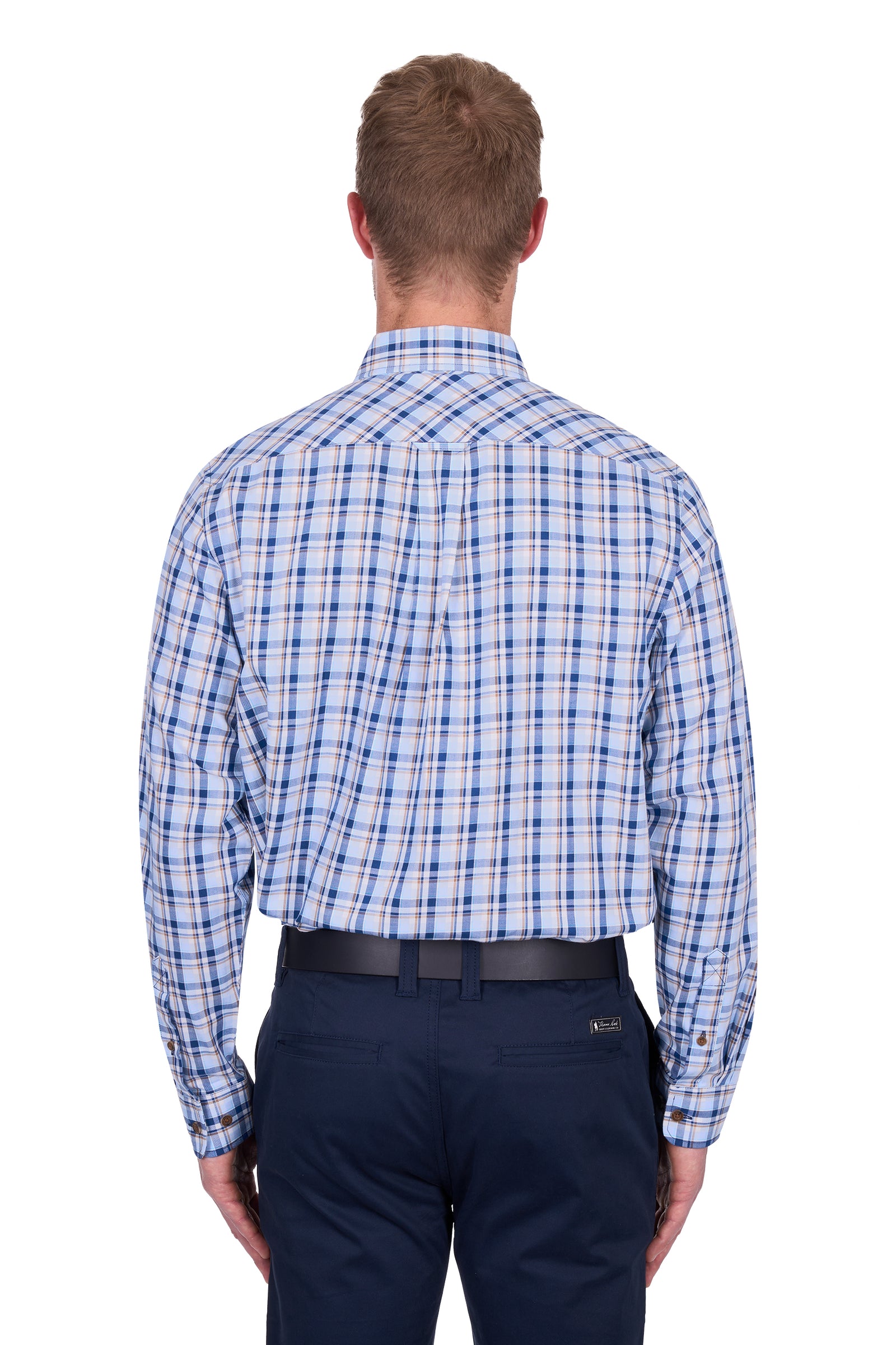 Thomas Cook Men's Thomas L/S Shirt. Man wearing a blue plaid shirt and navy pants on a white background