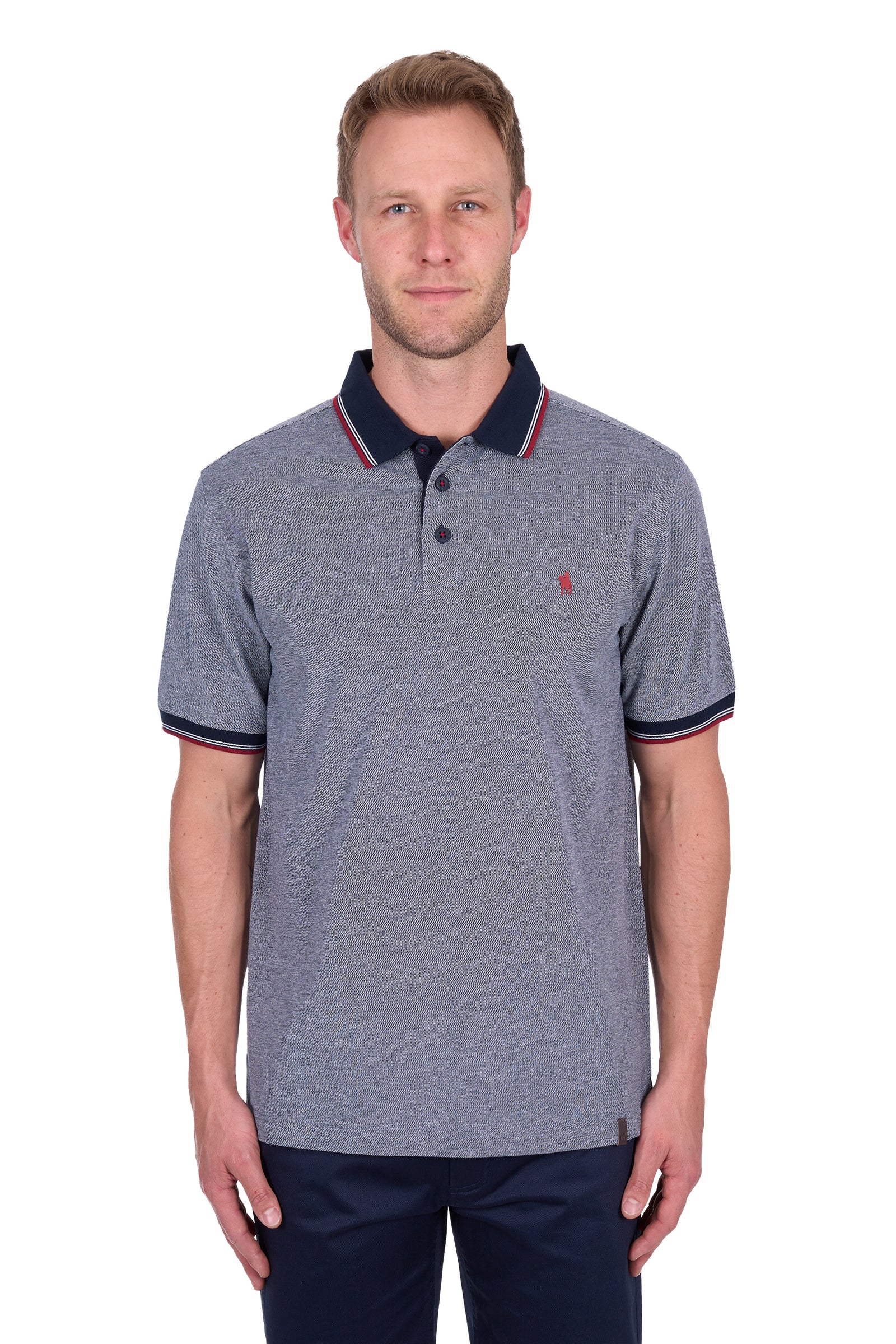 Man wearing a Thomas Cook Men's Dan Tailored S/S Polo. Navy Marle polo shirt with navy accents on a white background
