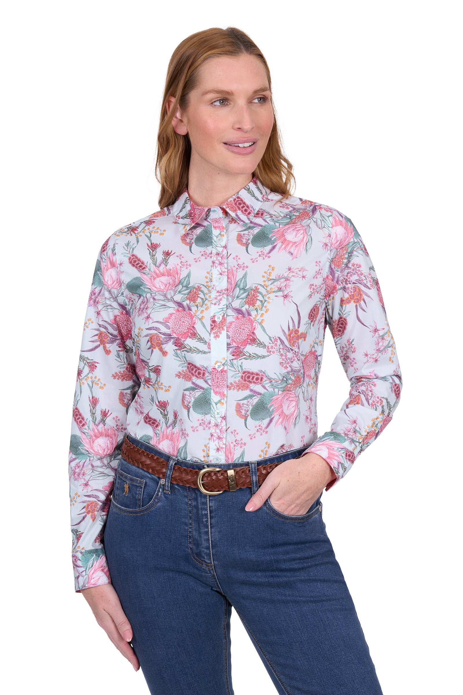 Thomas Cook Women's Ella L/S Shirt. Woman wearing a floral blouse and blue jeans on a white background