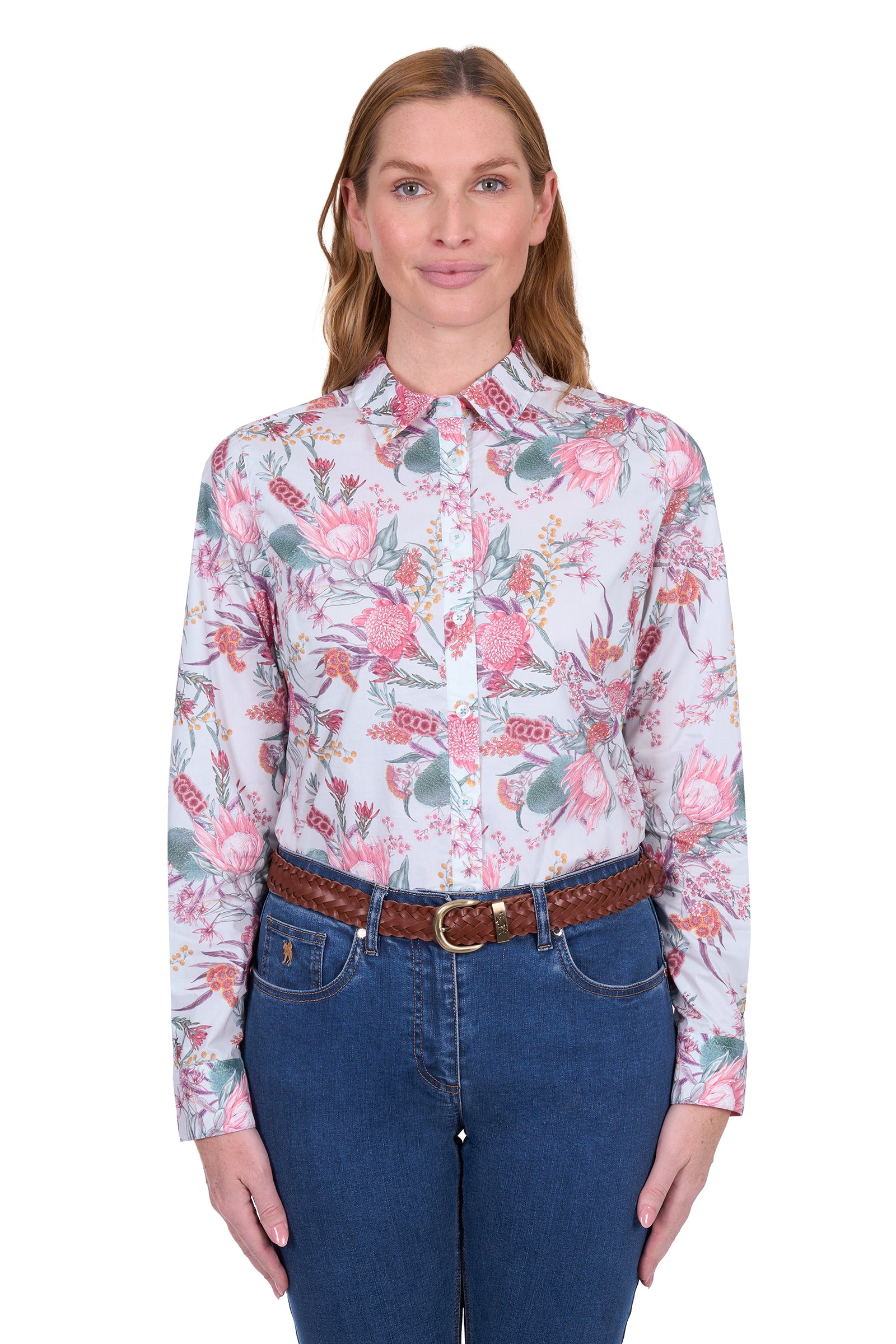Thomas Cook Women's Ella L/S Shirt. Woman wearing a floral shirt and blue jeans on a white background