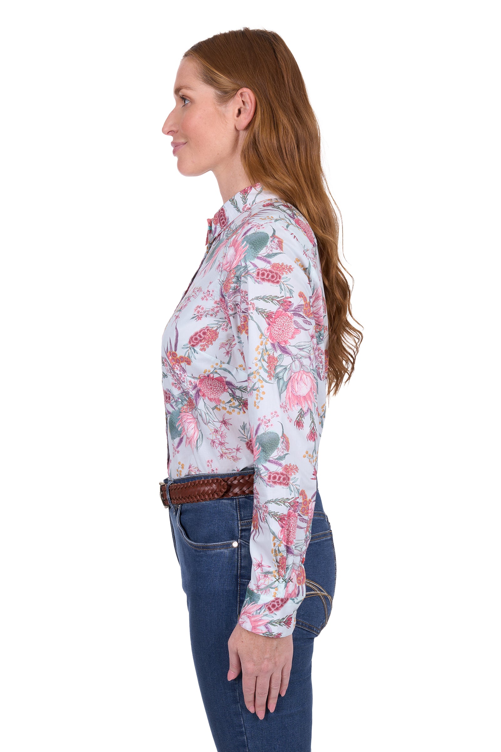 Thomas Cook Women's Ella L/S Shirt. Woman wearing a floral long-sleeve shirt and jeans on a white background