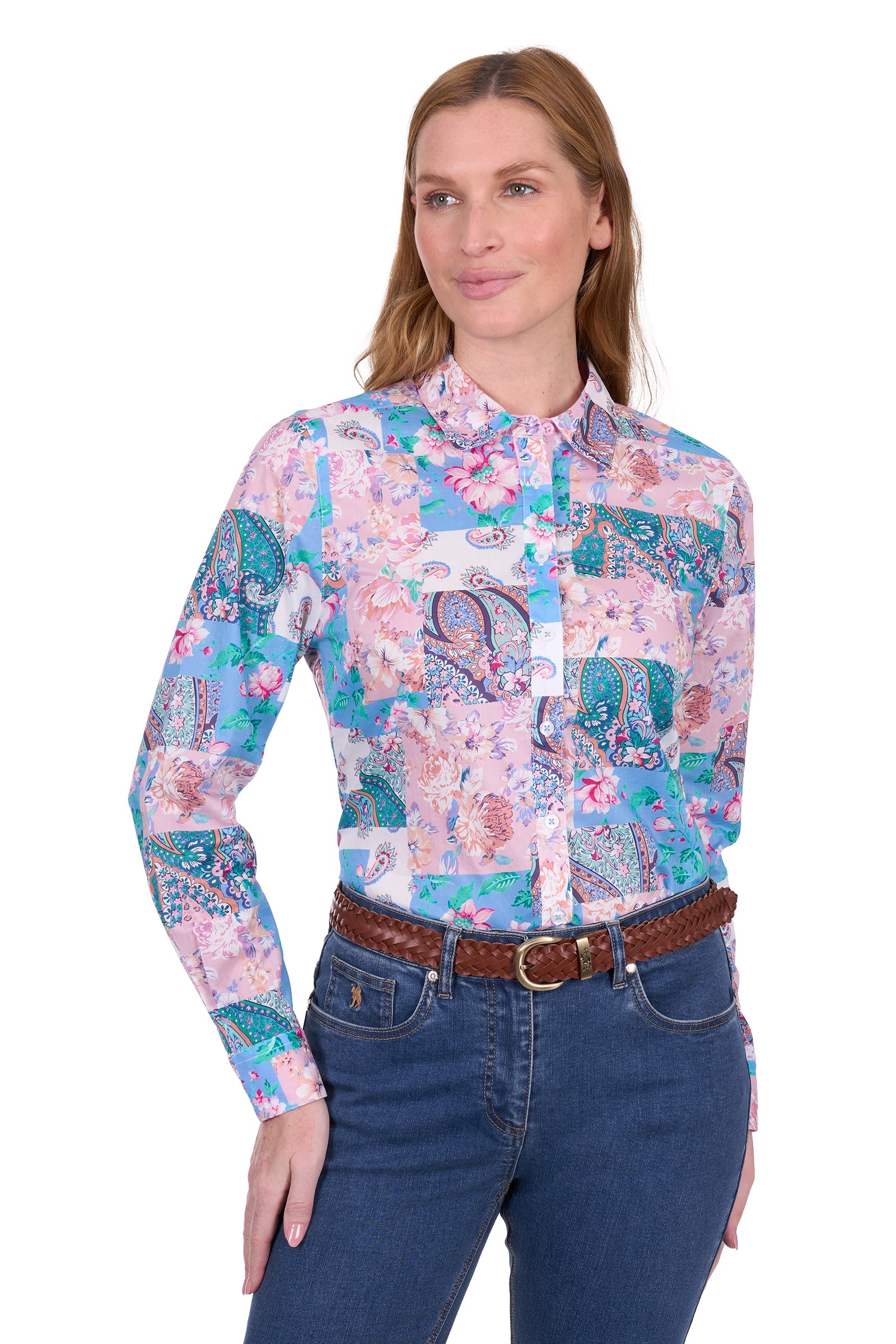 Thomas Cook Women's Annalise L/S Western Shirt. Woman wearing a colorful floral shirt and blue jeans on a white background