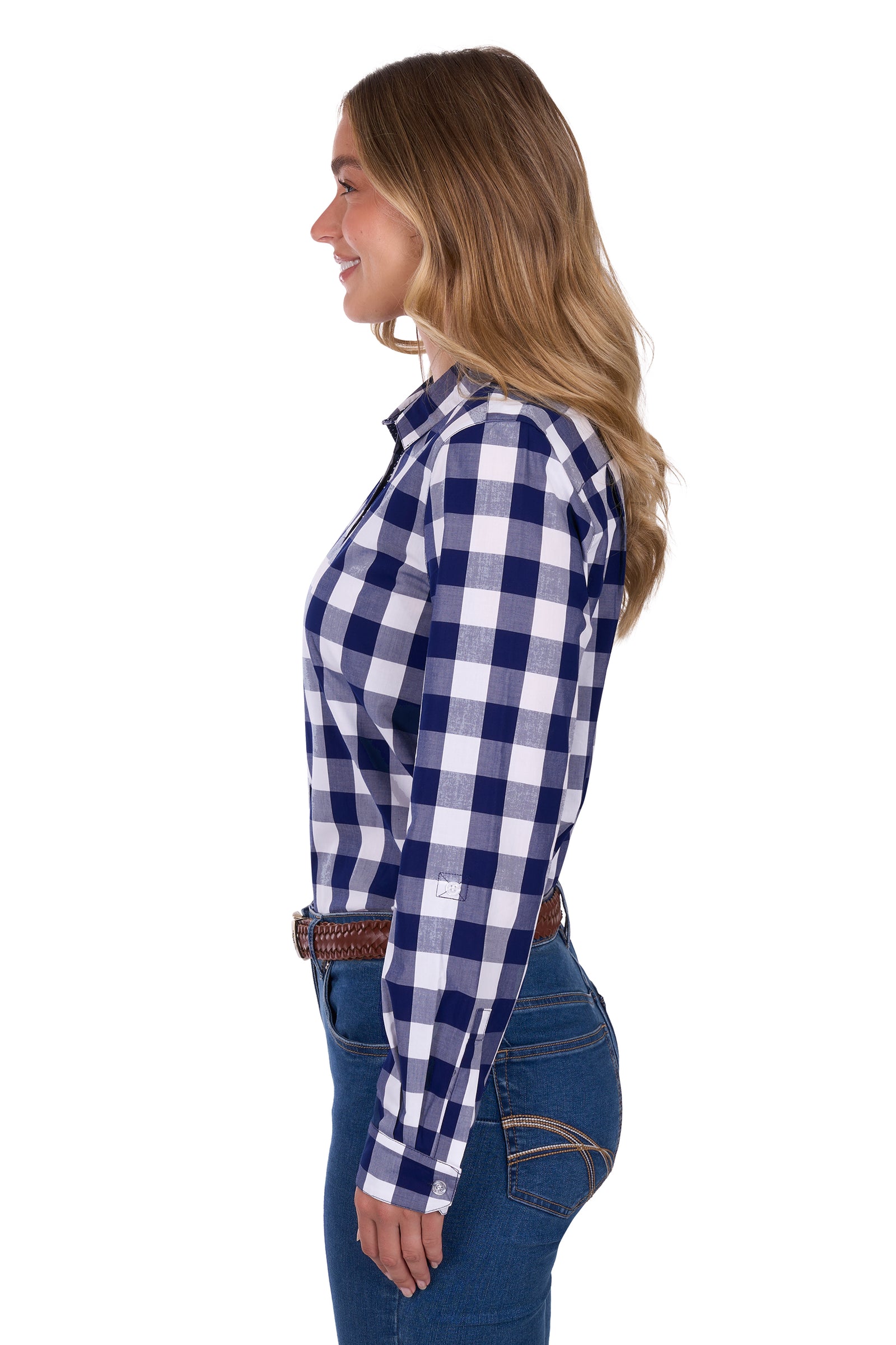 Side view of a woman wearing a Thomas Cook Women's Scarlet L/S Western Shirt. Bblue and white checkered shirt with jeans on a white background