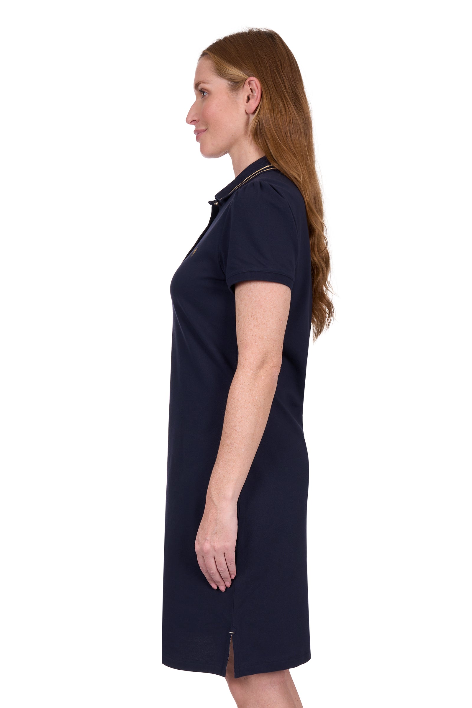 Side view of a woman wearing a Thomas Cook Women's Traci S/S Polo Dres. Navy blue polo dress with a small logo on a white background