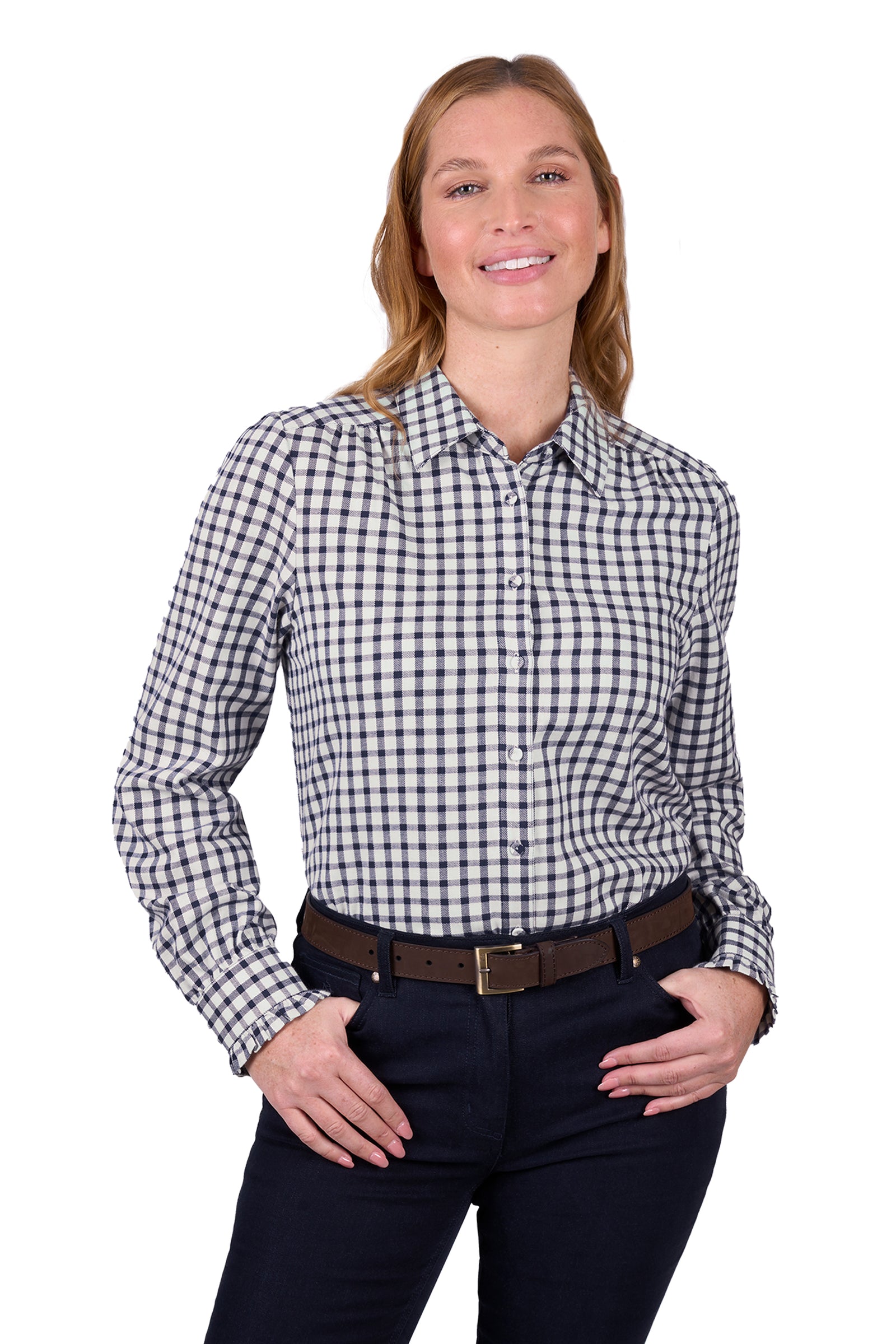 Thomas Cook Women's Rachel L/S Shirt. A woman wearing a long-sleeved checkered shirt with contrast taping and buttons, paired with dark pants.