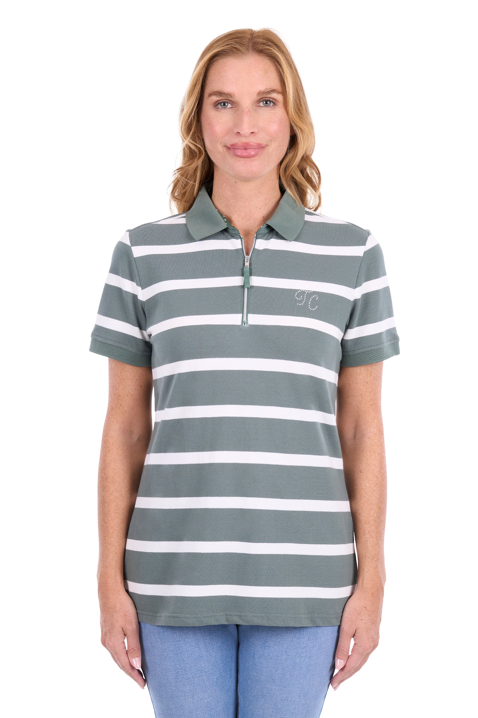 A woman modeling a short-sleeve polo shirt with horizontal sage green and white stripes, featuring a small embroidered logo on the left chest, set against a plain white background.