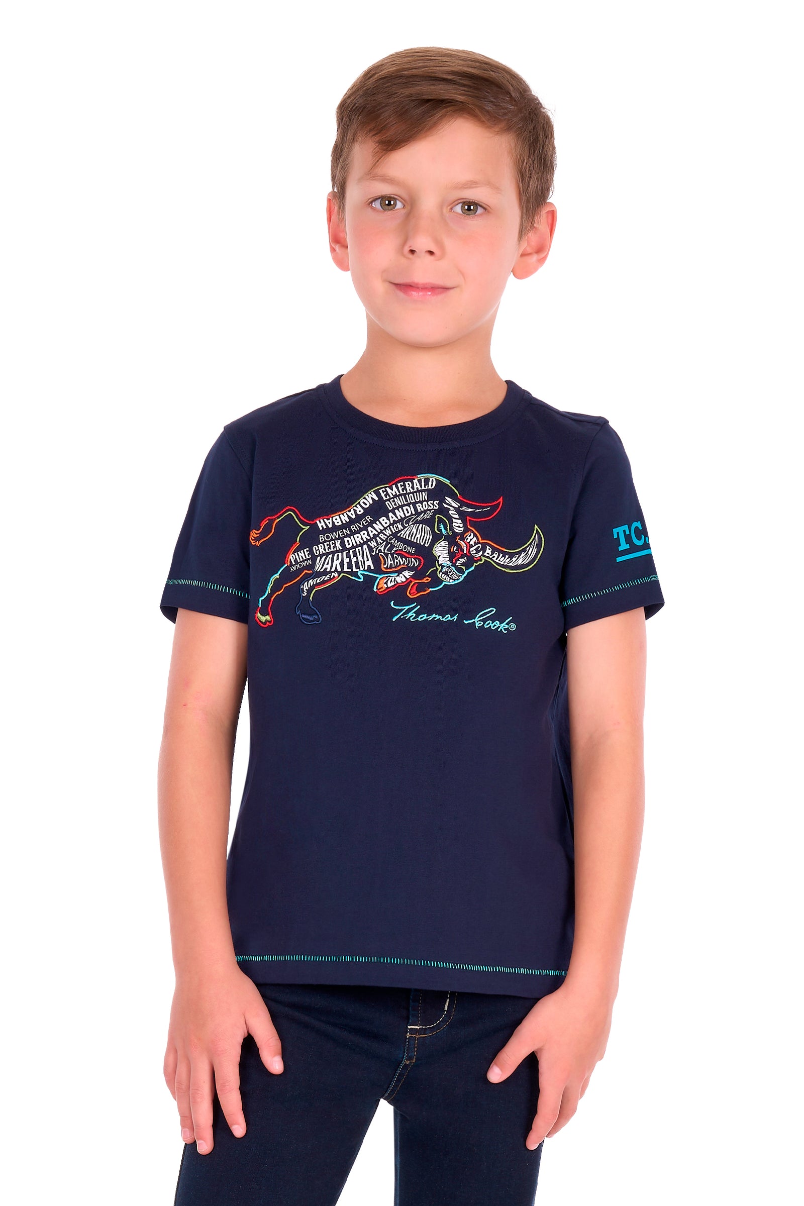 A young boy modeling a navy blue short-sleeve t-shirt with a colorful graphic of a running horse and the text 'Thomas Cook' on the front, set against a plain white background.
