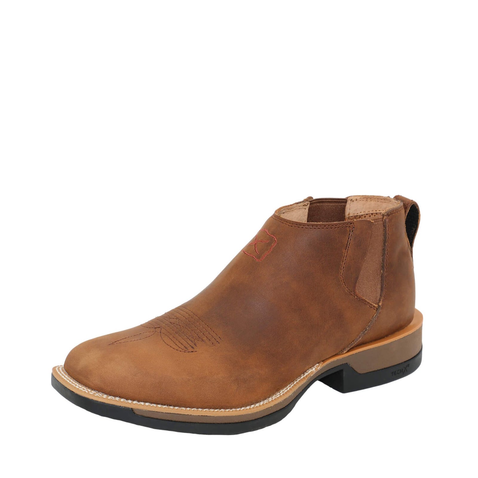 Twisted X Men's 4" Tech X1 Chelsea Western Boot. A brown Twisted X Men's 4 inch Tech X1 Chelsea Western Boot with a slip-on design, showcasing the side zipper and the low heel.