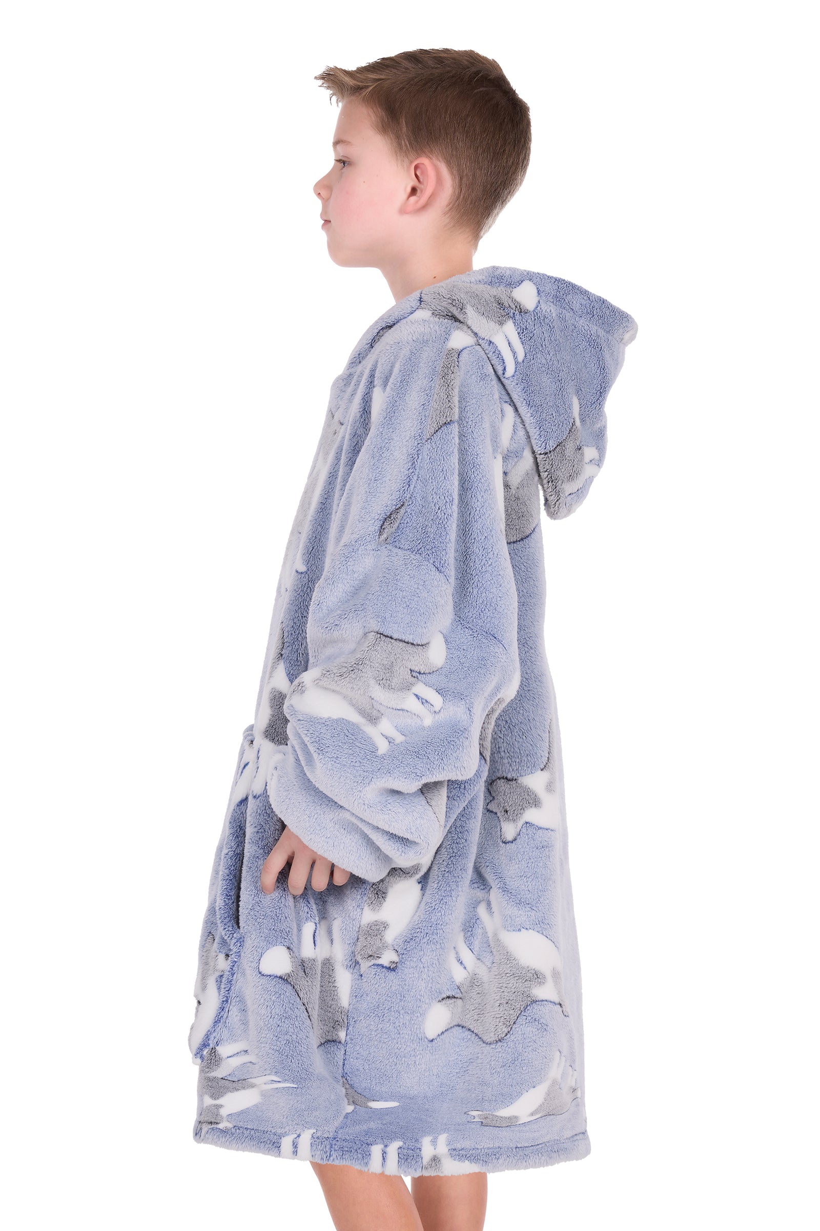 Child wearing a blue hooded towel with animal prints on a white background