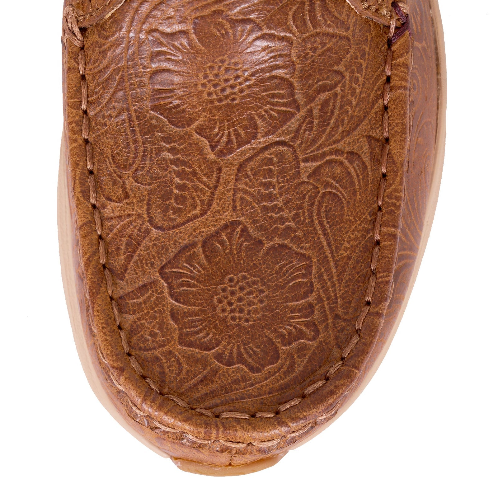 Twisted X Women's Ultralite X Casual . Close-up of a brown leather moccasin with floral embossing on a white background
