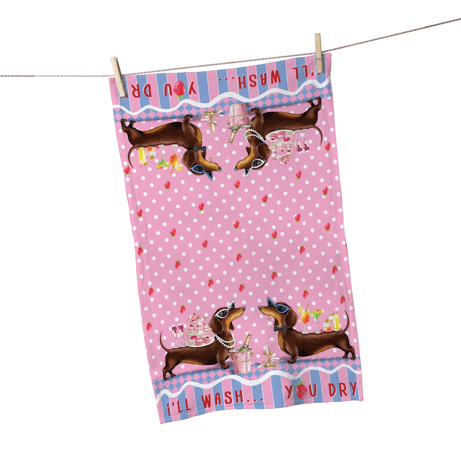 Pink polka dot towel with dachshund design hanging on a line.
