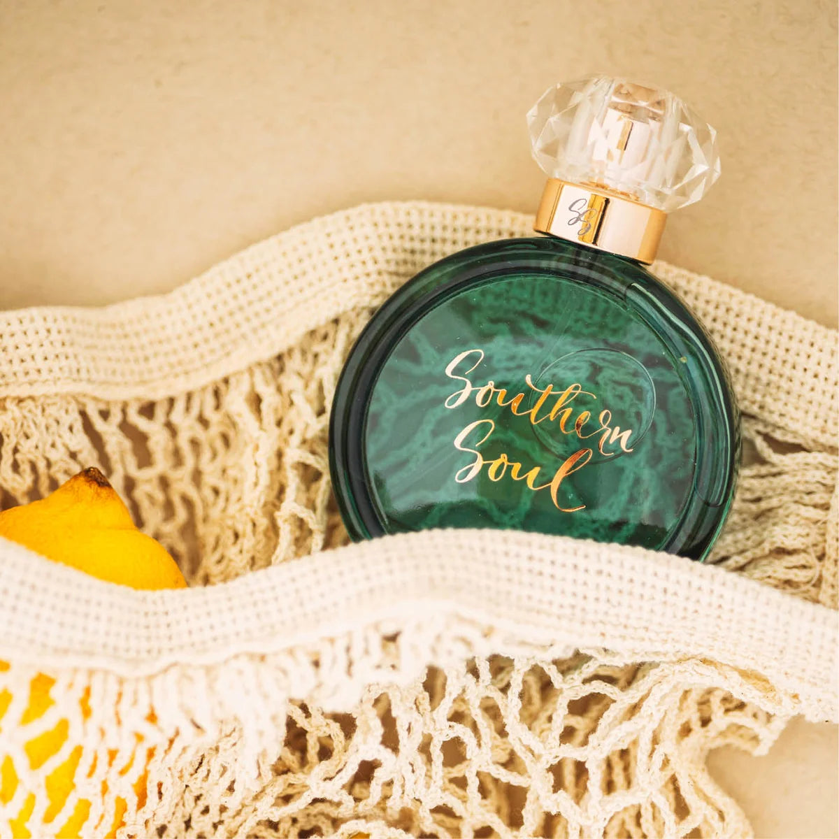 Perfume bottle labeled 'Southern Soul' in a textured bag with a neutral background