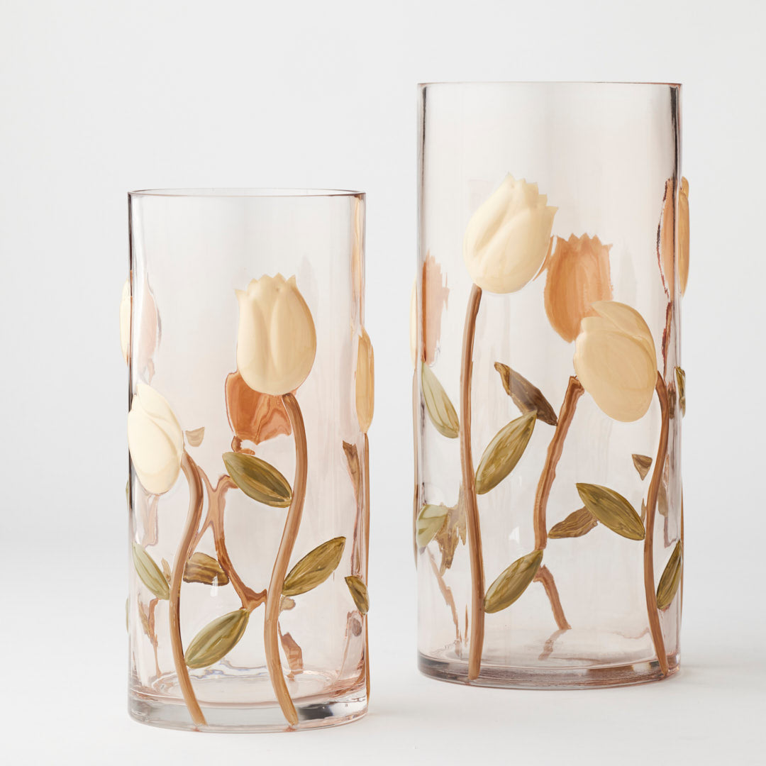Two glass tumblers with floral designs on a white background